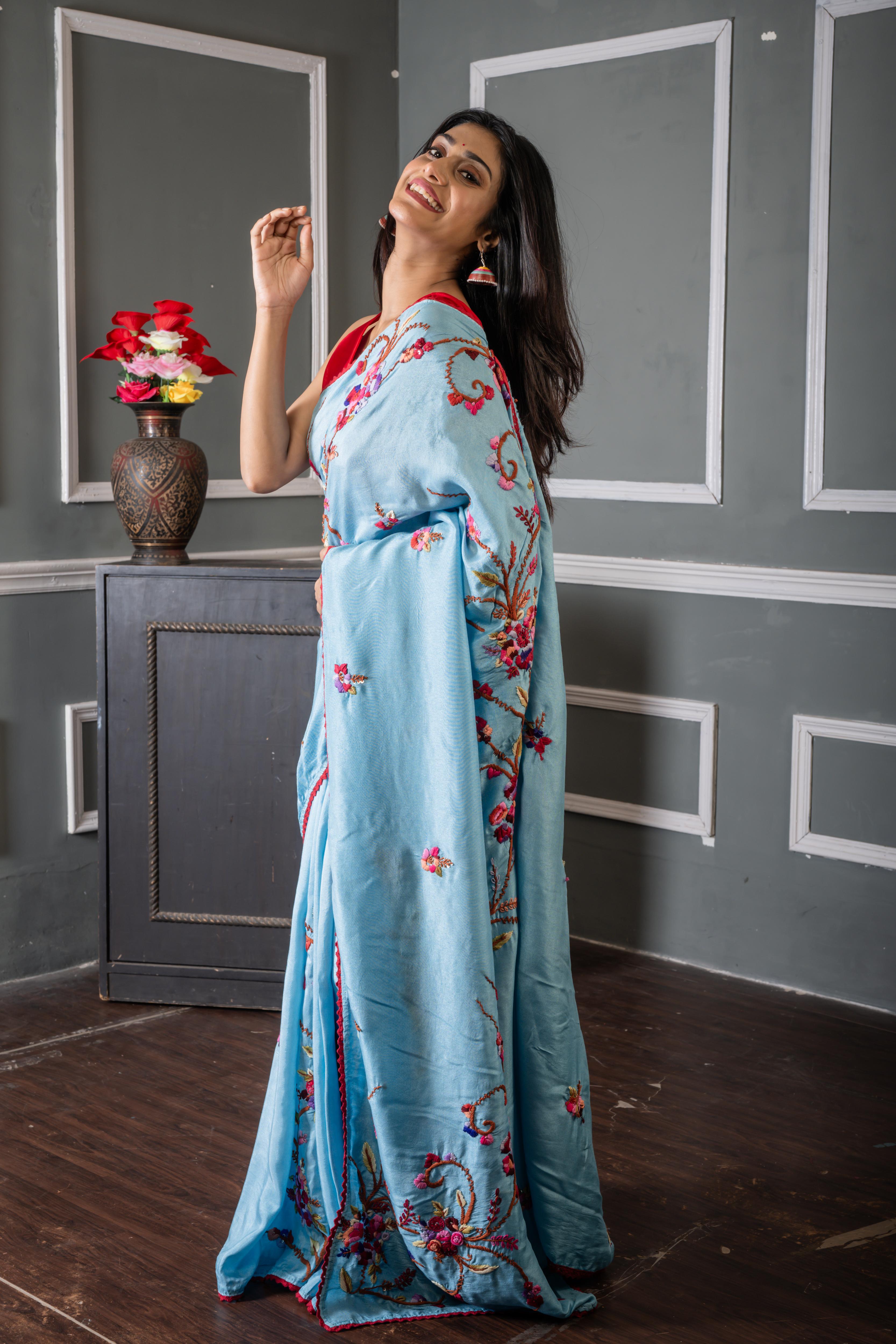 Roya || Sky Blue Russian Silk Hand Embroidery Saree with all over Multi-colour Resham Boolean Parsi Floral motif and Sequins Highlights