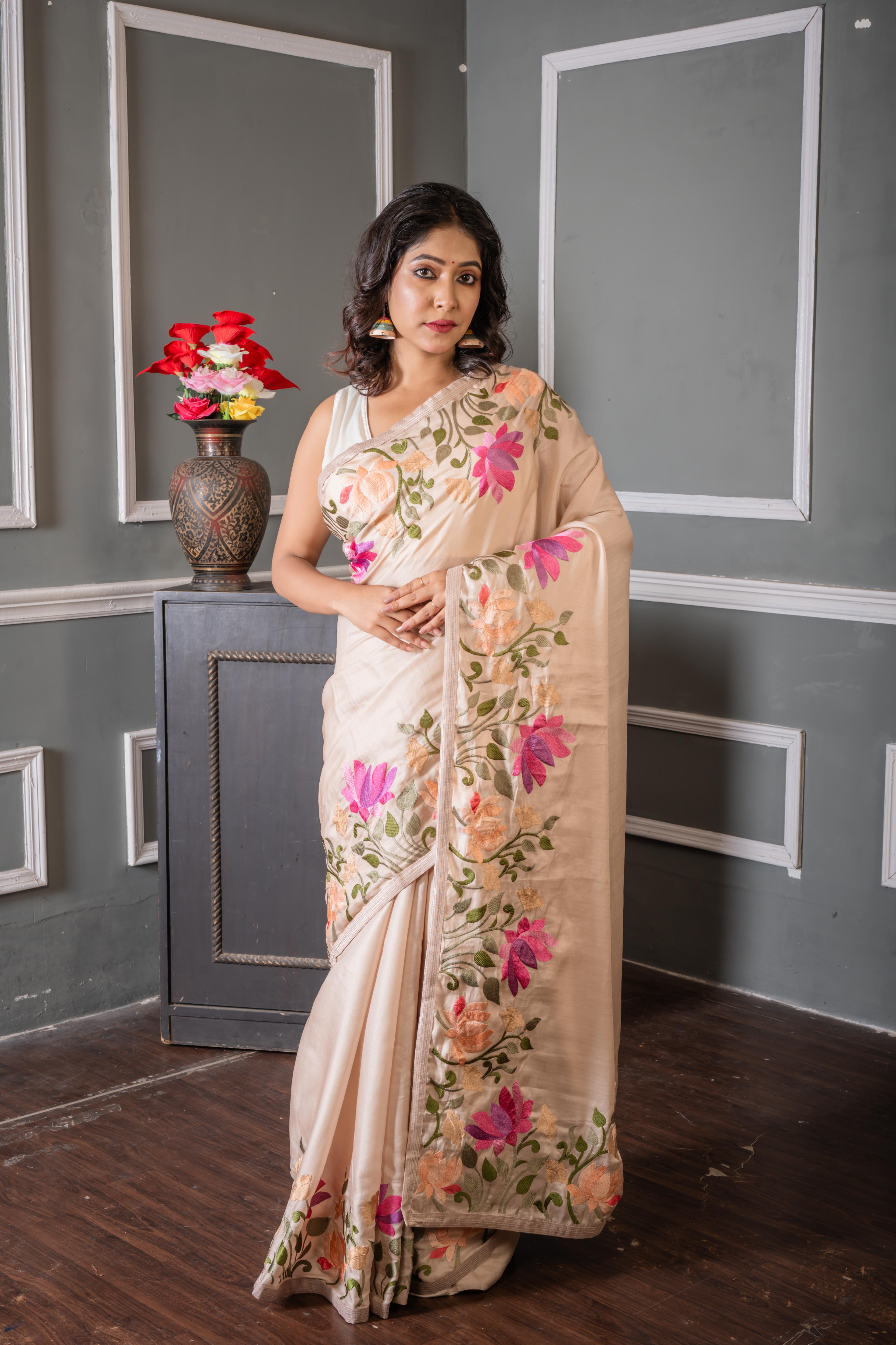 Shrinika || Smokey Taupe Soft Tussar Silk Hand Embroidery Saree with Plain Body and Multi-colour Lotus motif on border