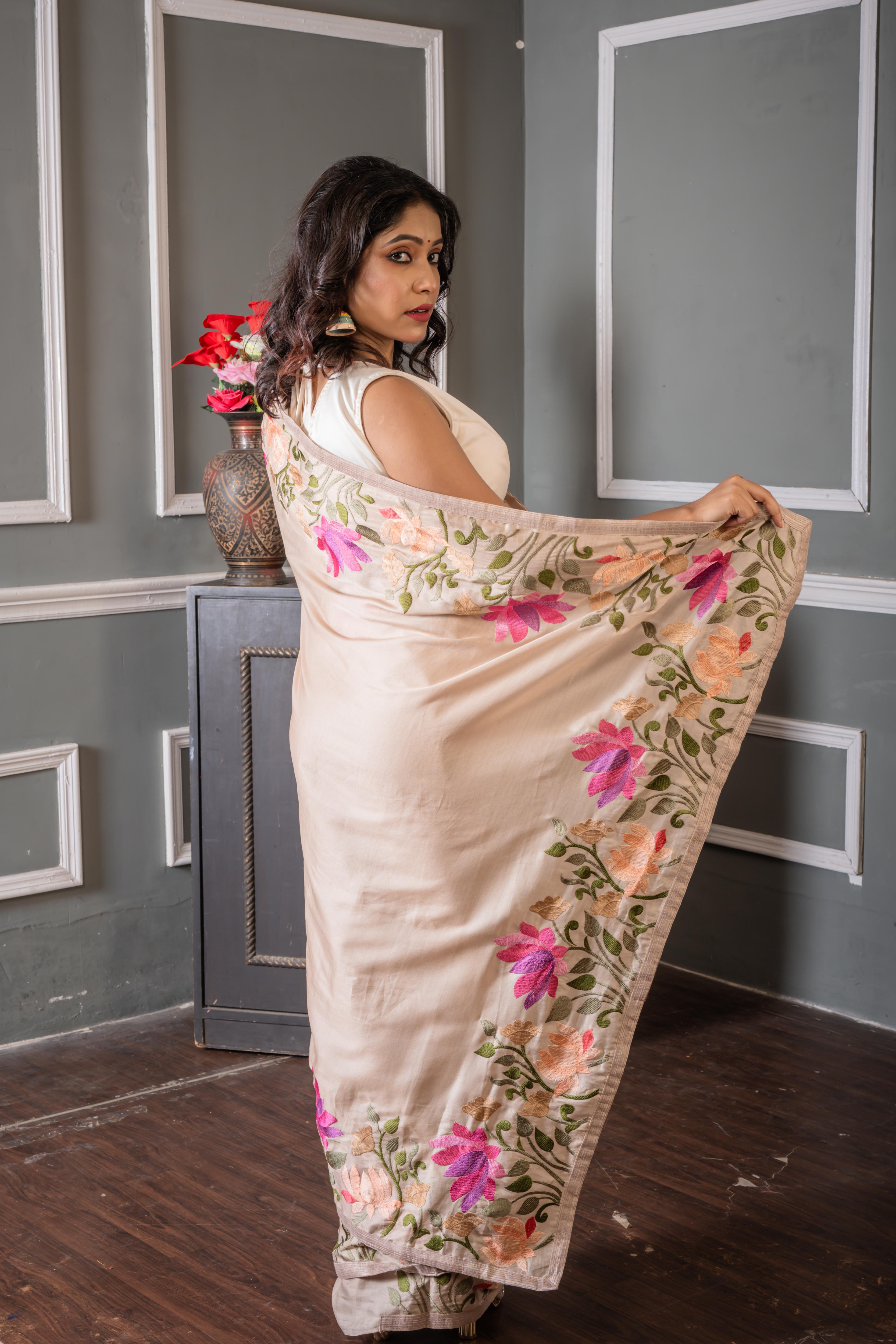 Shrinika || Smokey Taupe Soft Tussar Silk Hand Embroidery Saree with Plain Body and Multi-colour Lotus motif on border