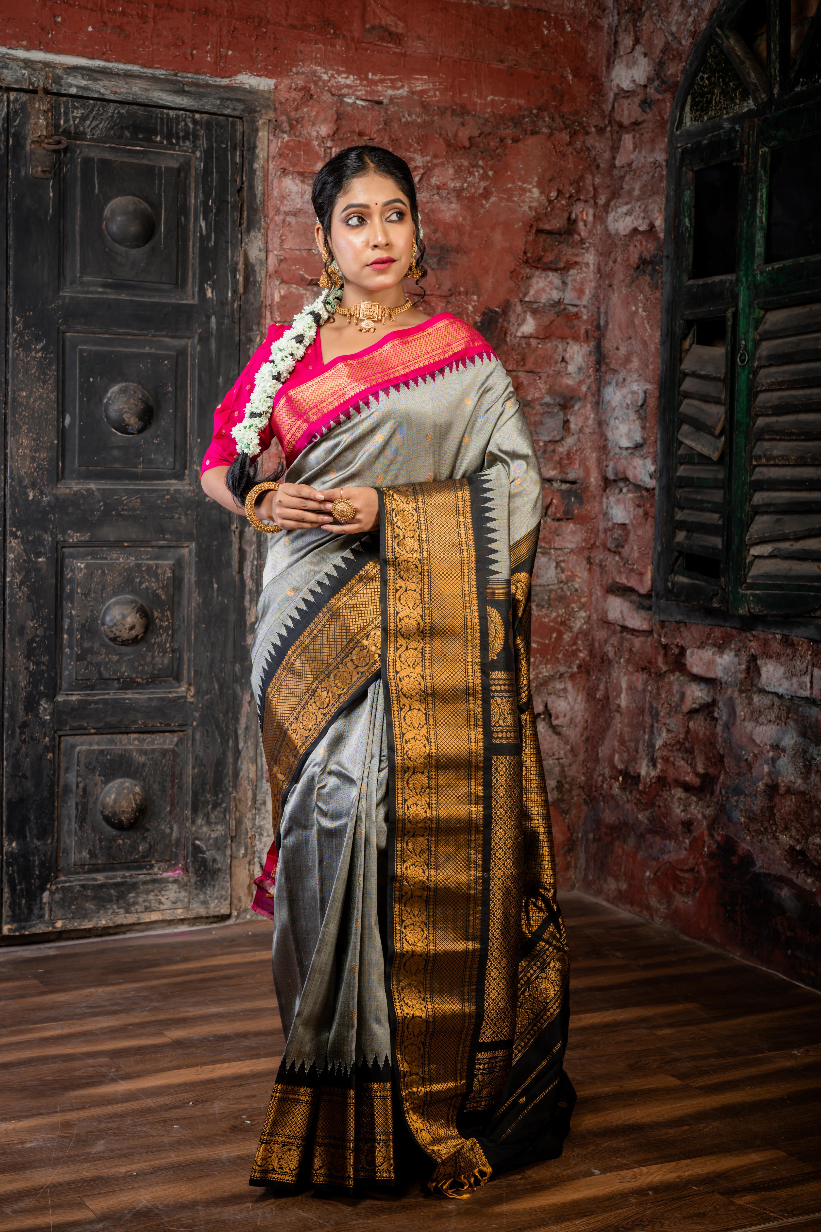 Rajeshwari || Smokey Grey Pure Gadwal Silk Handloom Saree with all over Antique Gold Buti, Magenta & Black 'Temple' & Antique Zari 'Ganga-Jamuna' Border and Black Pallu in Traditional Antique Gold Zari design