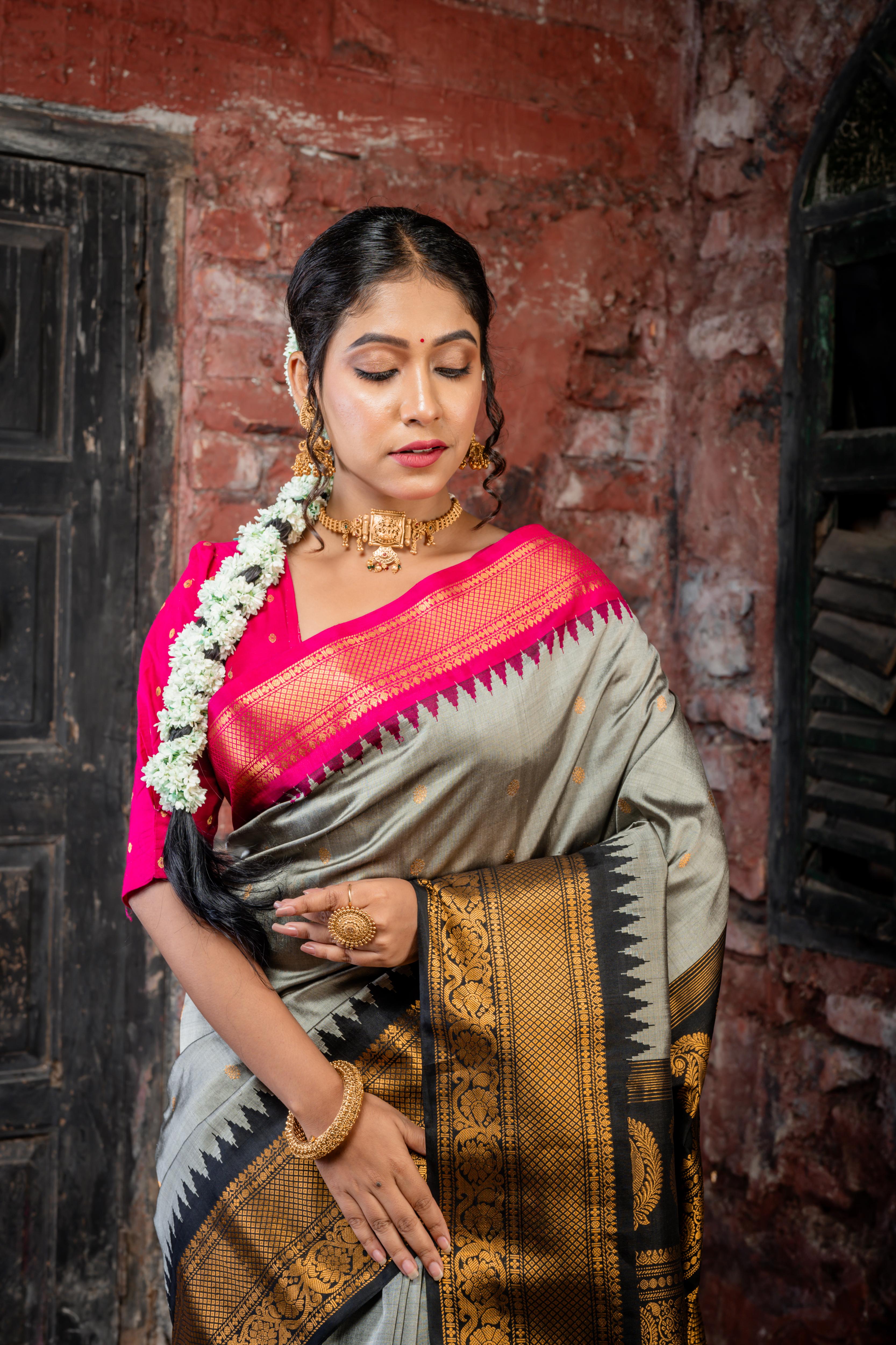 Rajeshwari || Smokey Grey Pure Gadwal Silk Handloom Saree with all over Antique Gold Buti, Magenta & Black 'Temple' & Antique Zari 'Ganga-Jamuna' Border and Black Pallu in Traditional Antique Gold Zari design