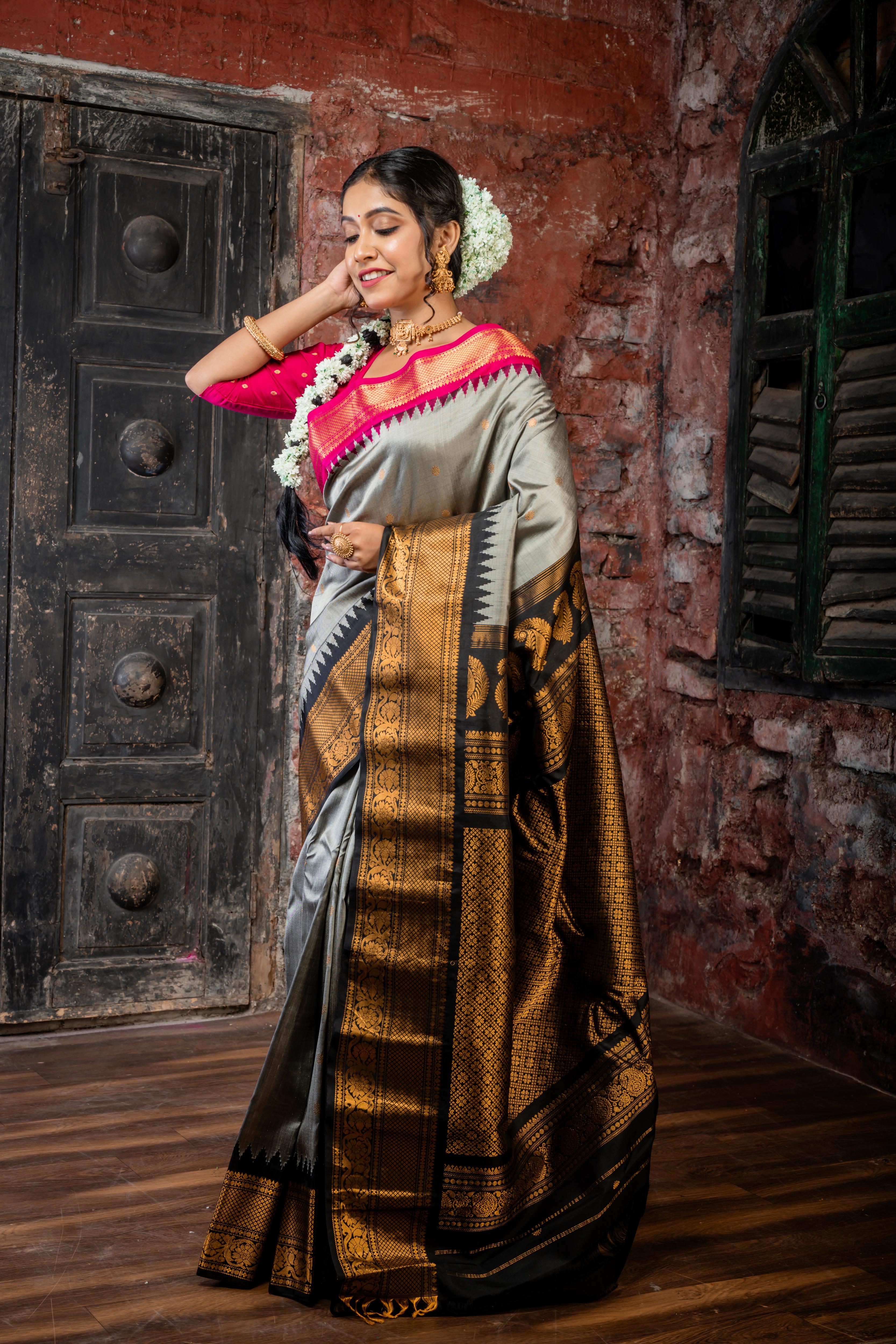 Rajeshwari || Smokey Grey Pure Gadwal Silk Handloom Saree with all over Antique Gold Buti, Magenta & Black 'Temple' & Antique Zari 'Ganga-Jamuna' Border and Black Pallu in Traditional Antique Gold Zari design