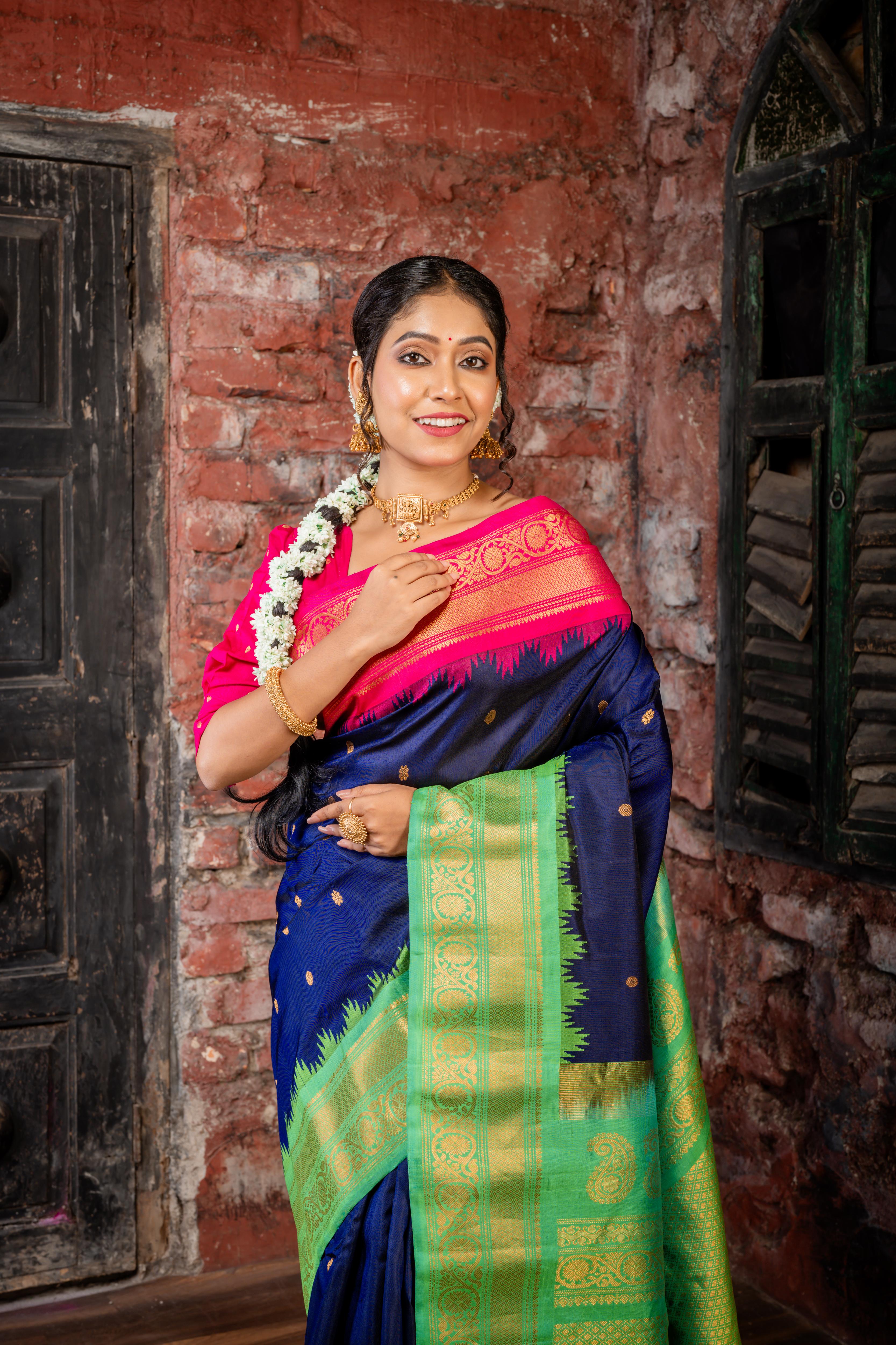 Meenakshi || Violet Pure Gadwal Silk Handloom Saree with all over Antique Gold Buti, Magenta & Parrot Green 'Temple' & Antique Gold Zari 'Ganga-Jamuna' Border and Parrot Green Pallu in Traditional Golden Zari design