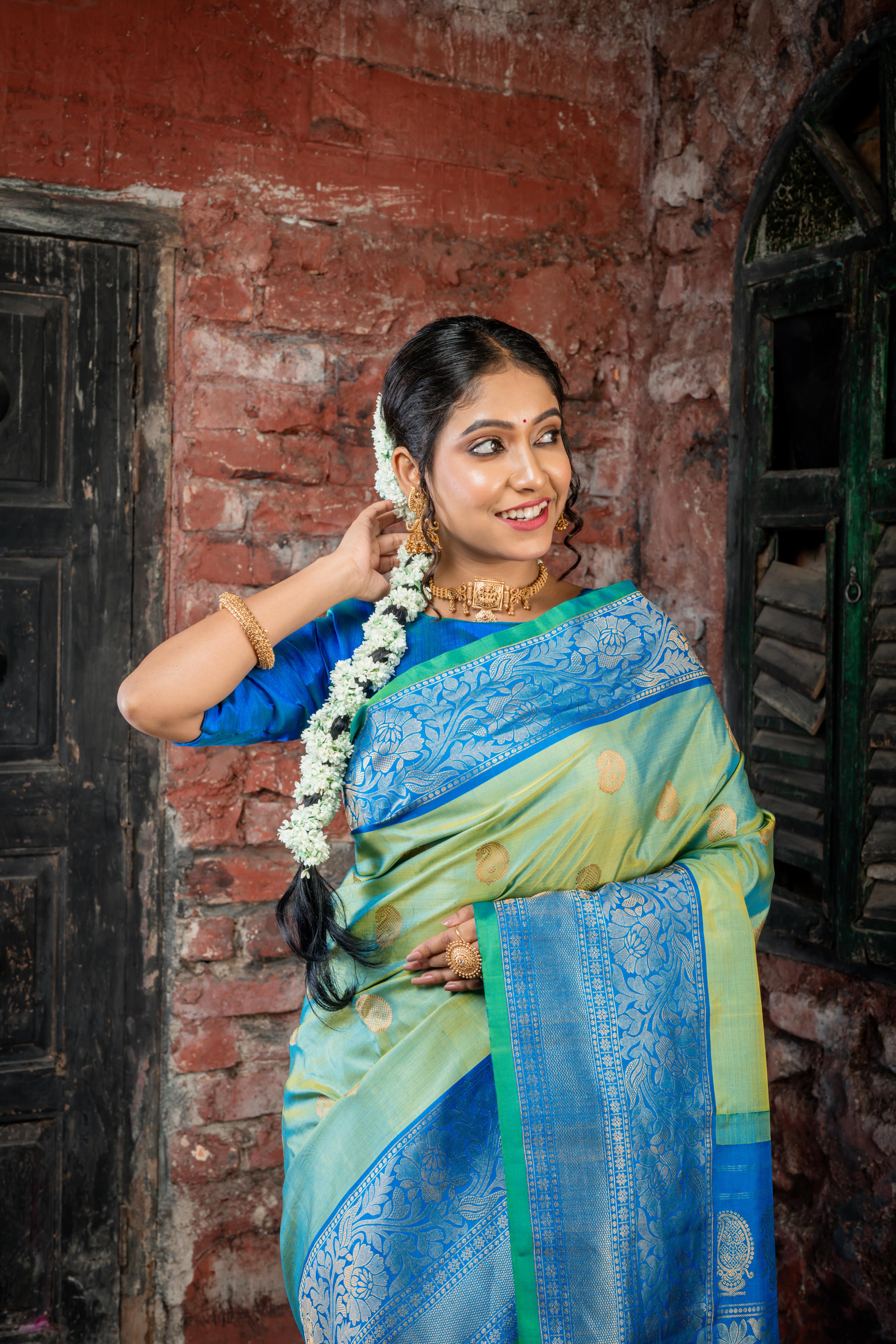 Narayani || Olive Green & Peacock Blue dual tone Pure Gadwal Silk Handloom Saree with all over Antique Gold Zari 'Kalka' Buta; Peacock Blue, Green & Antique Gold Zari Traditional design Border and Brocade Pallu
