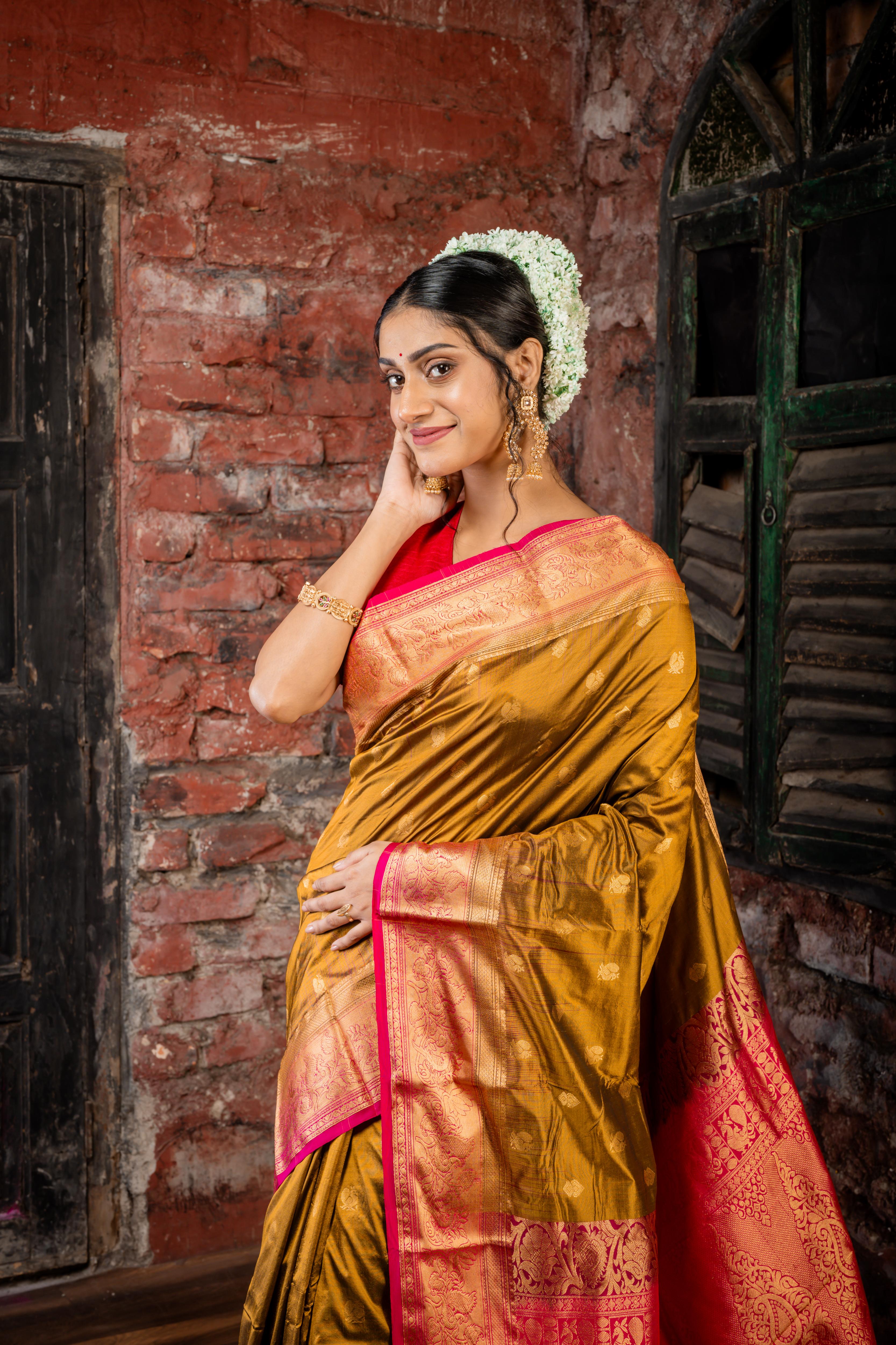 Mrunalini || Olive Brown & Gold dual tone Pure Kanjivaram Silk Handloom Saree with all over Golden Zari 'Peacock' motif Buta, Magenta broad & Golden Zari Border and traditional design Pallu