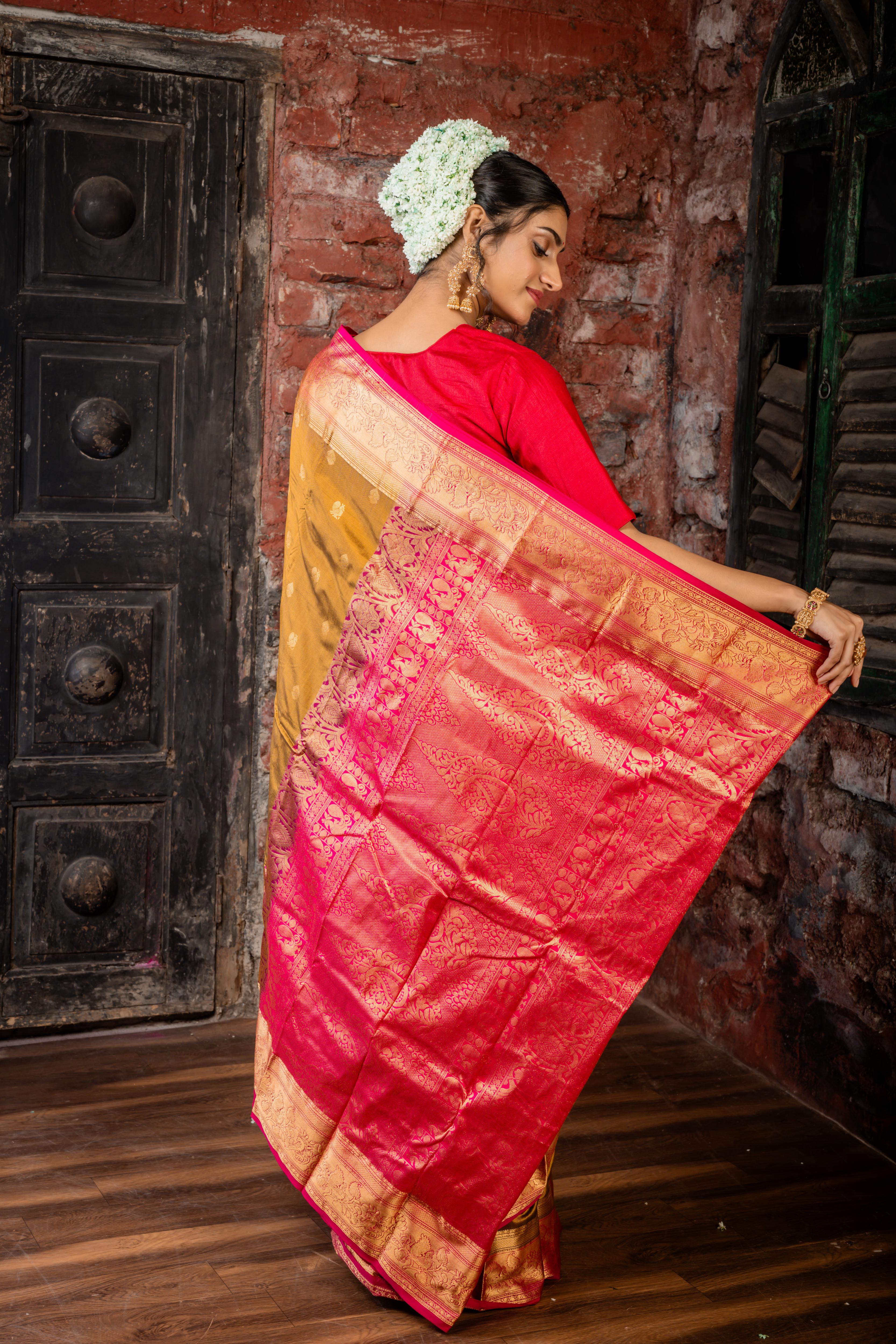 Mrunalini || Olive Brown & Gold dual tone Pure Kanjivaram Silk Handloom Saree with all over Golden Zari 'Peacock' motif Buta, Magenta broad & Golden Zari Border and traditional design Pallu
