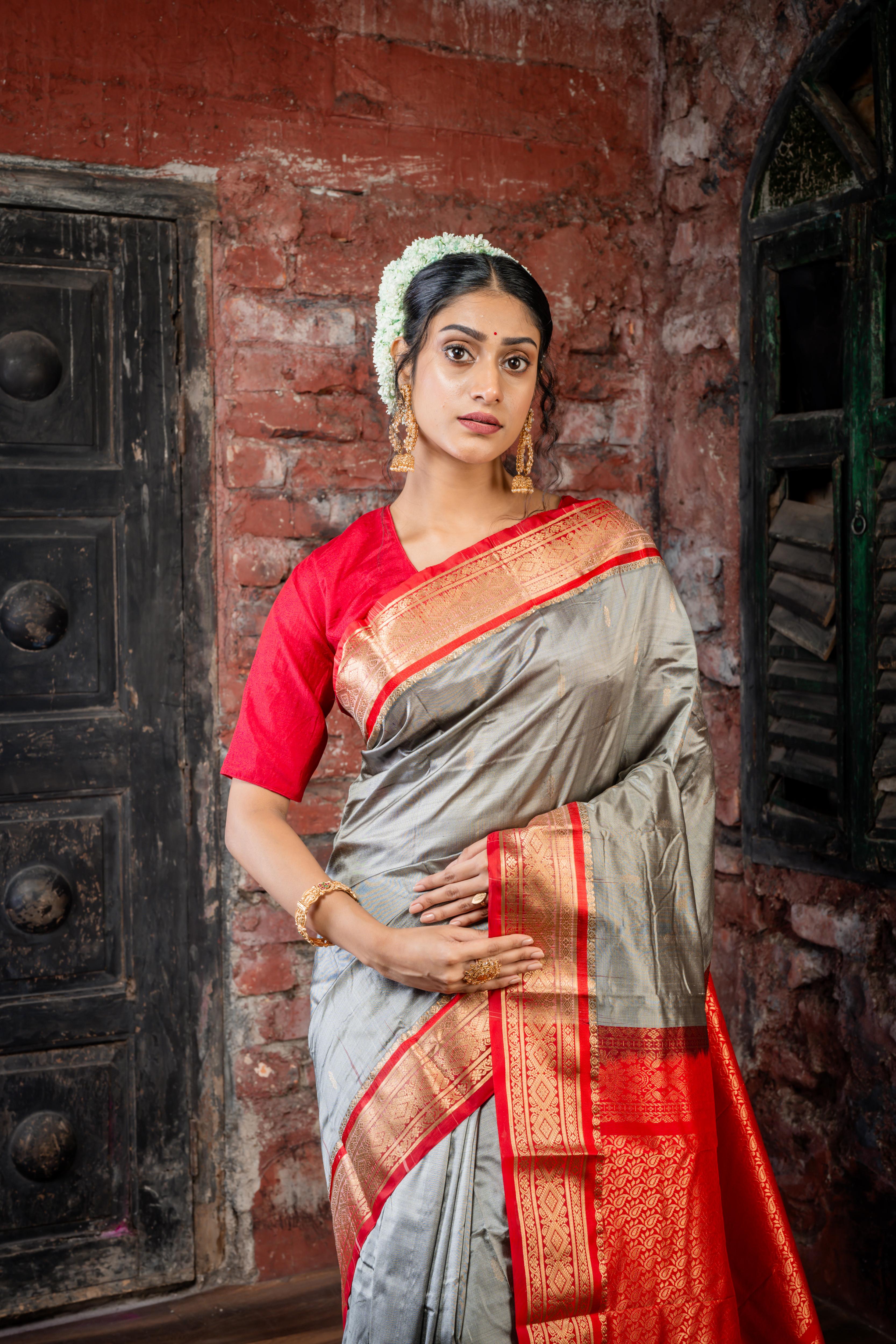 Amala || Smokey Grey Kanjivaram Silk Saree with all over Matte Gold Zari Buti, Red & Matte Gold Zari Border and Red Pallu in Matte Gold Zari Traditional 'Kalka' design