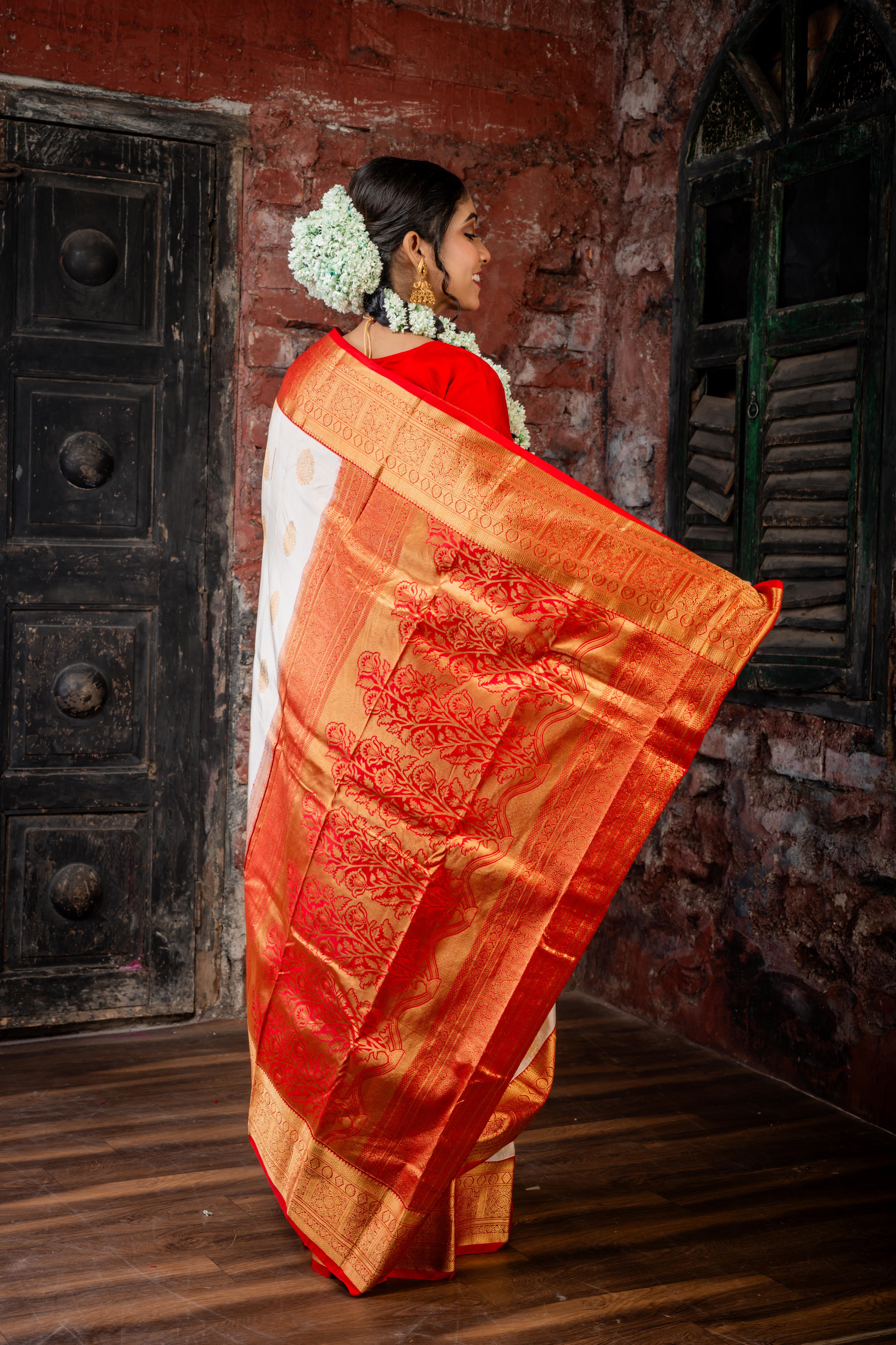Chinmayi || Ivory Gold Pure Kanjivaram Silk Handloom Saree with all over Golden Zari traditional Buta, Red broad & Golden Zari Border and traditional Floral motif Pallu