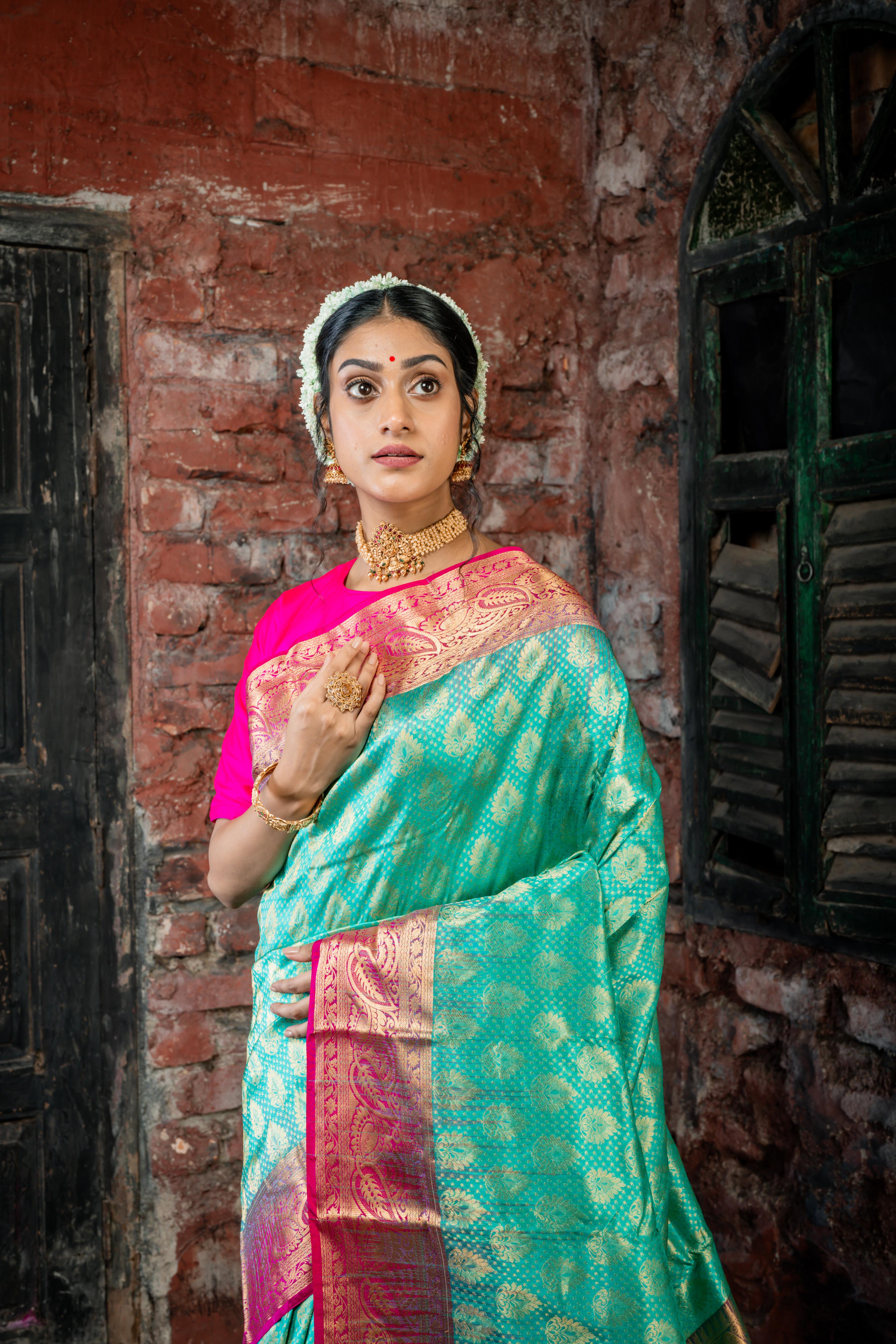 Keerthi || Teal Green Pure Kanjivaram Silk Handloom Saree with all over Matte Gold Zari traditional motif Buta, Magenta broad & Golden Zari Border and traditional design Brocade Pallu