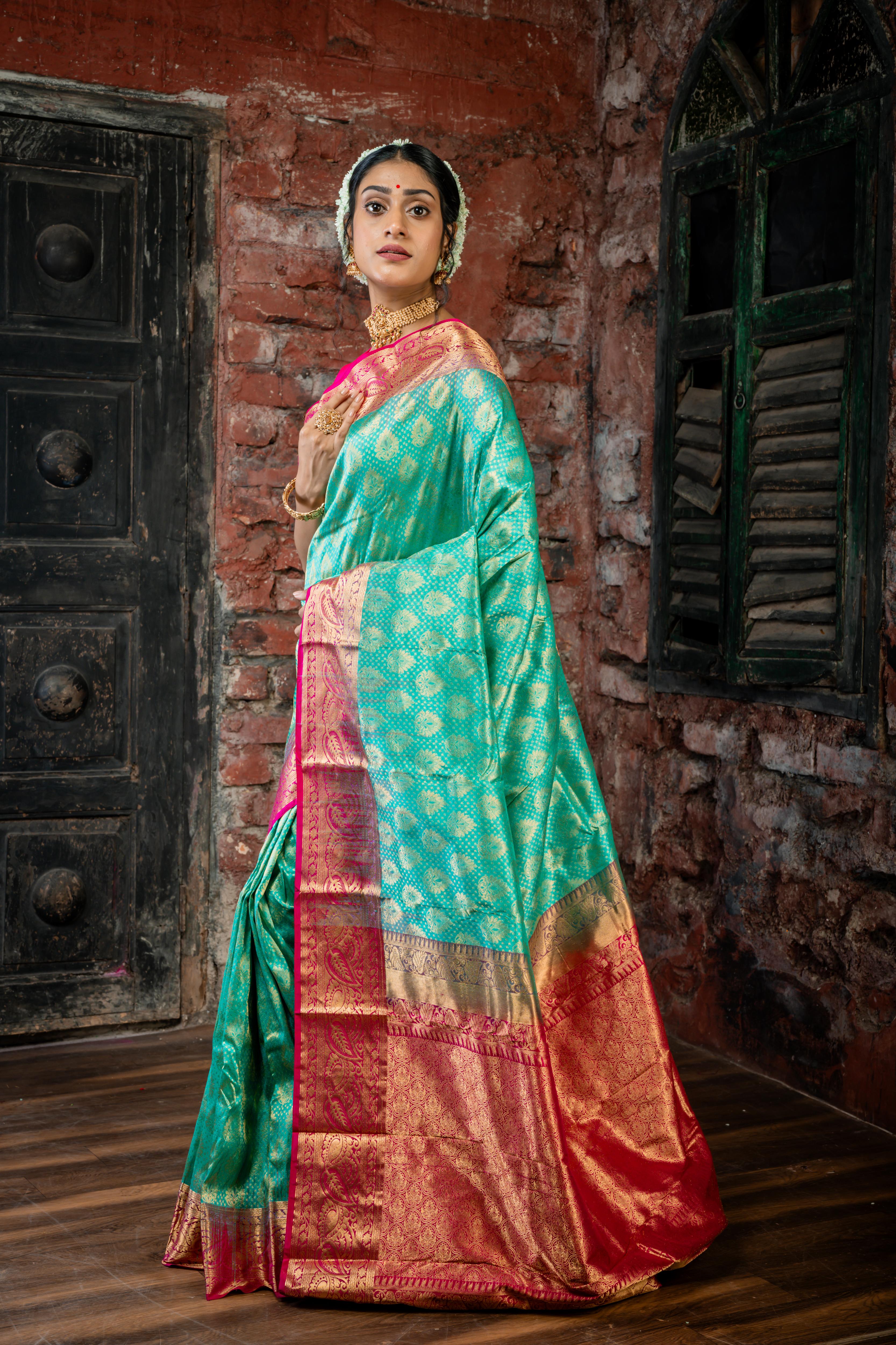 Keerthi || Teal Green Pure Kanjivaram Silk Handloom Saree with all over Matte Gold Zari traditional motif Buta, Magenta broad & Golden Zari Border and traditional design Brocade Pallu