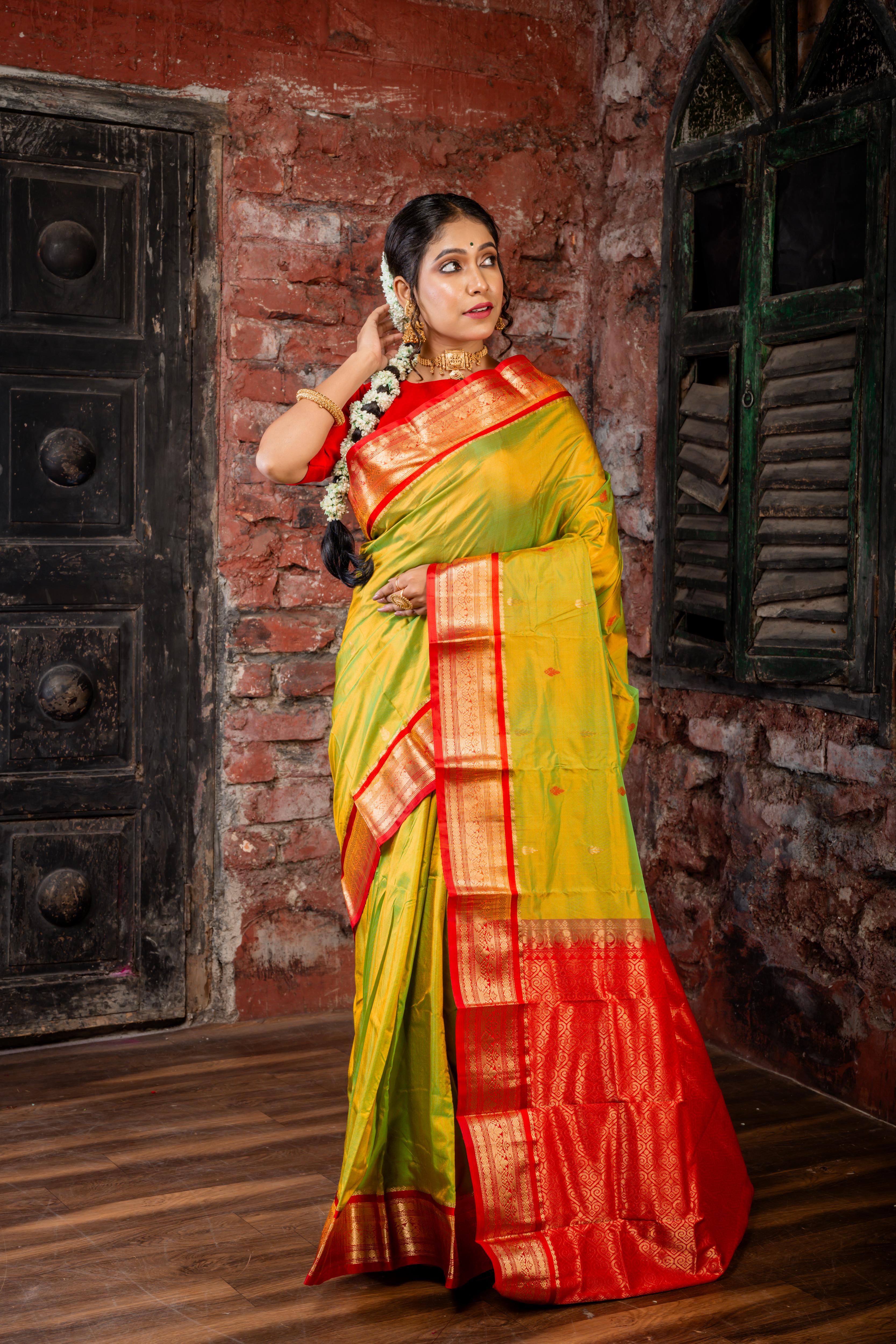 Vanathi || Olive Green & Gold dual tone Kanjivaram Silk Saree with all over Matte Gold Zari & Red Resham Buta and Red & Matte Gold Zari Traditional design Border & Pallu