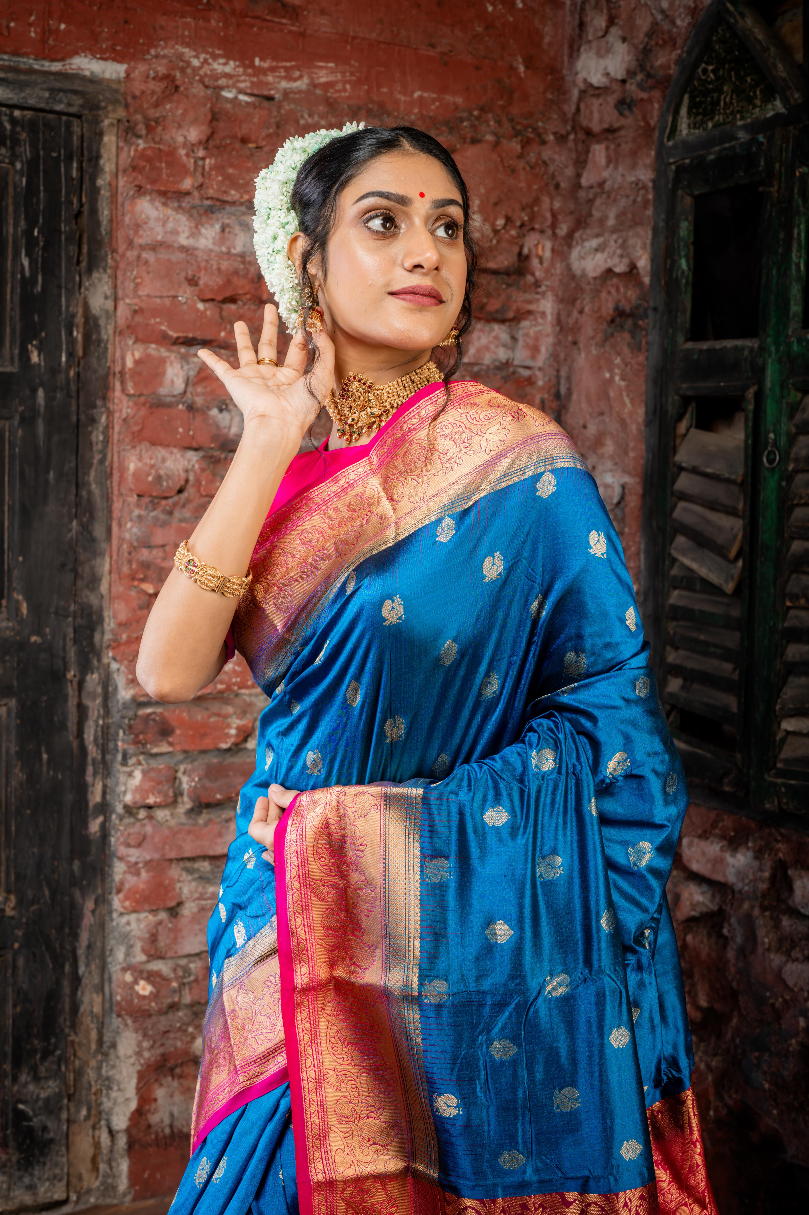 Mayura || Peacock Blue Pure Kanjivaram Silk Handloom Saree with all over Golden Zari 'Peacock' motif Buta, Magenta broad & Golden Zari Border and traditional design Pallu