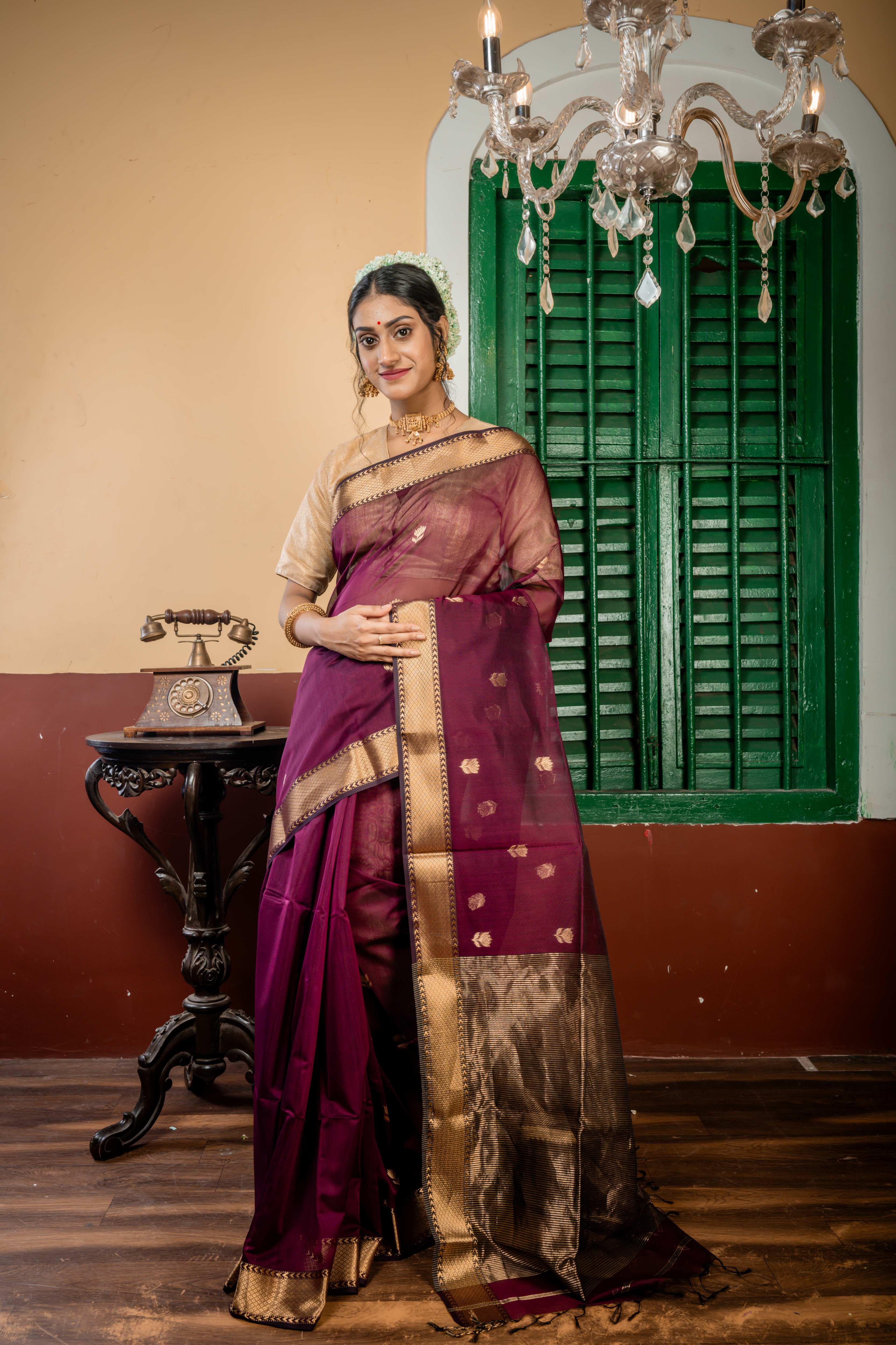 Sulochana || Wine Cotton Resham Maheshwari Handloom Saree with all over Antique Gold Zari Floral motif Buta, Black & Antique Gold Zari Brocade Border and Black & Antique Gold Stripe Pallu
