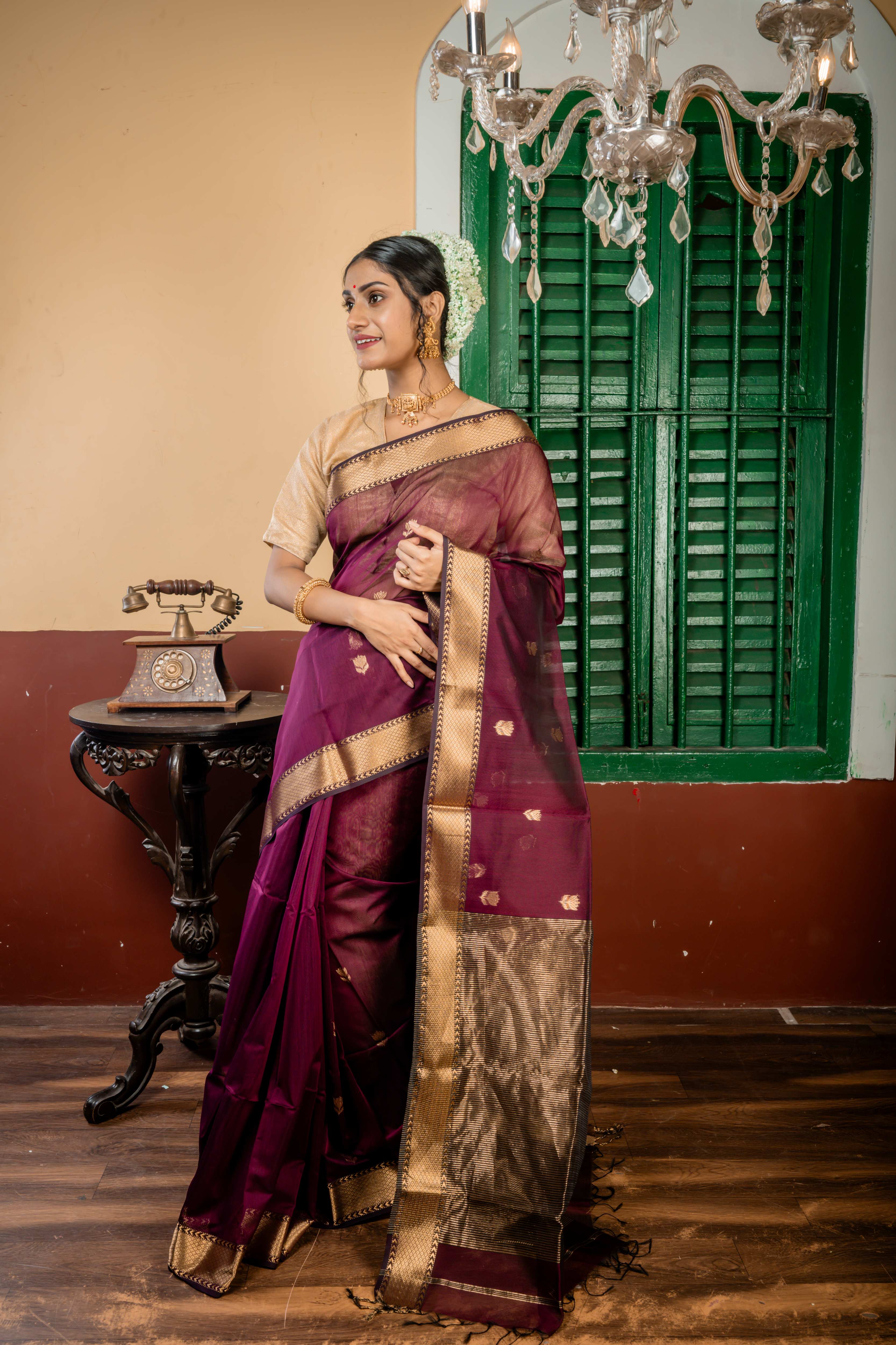 Sulochana || Wine Cotton Resham Maheshwari Handloom Saree with all over Antique Gold Zari Floral motif Buta, Black & Antique Gold Zari Brocade Border and Black & Antique Gold Stripe Pallu