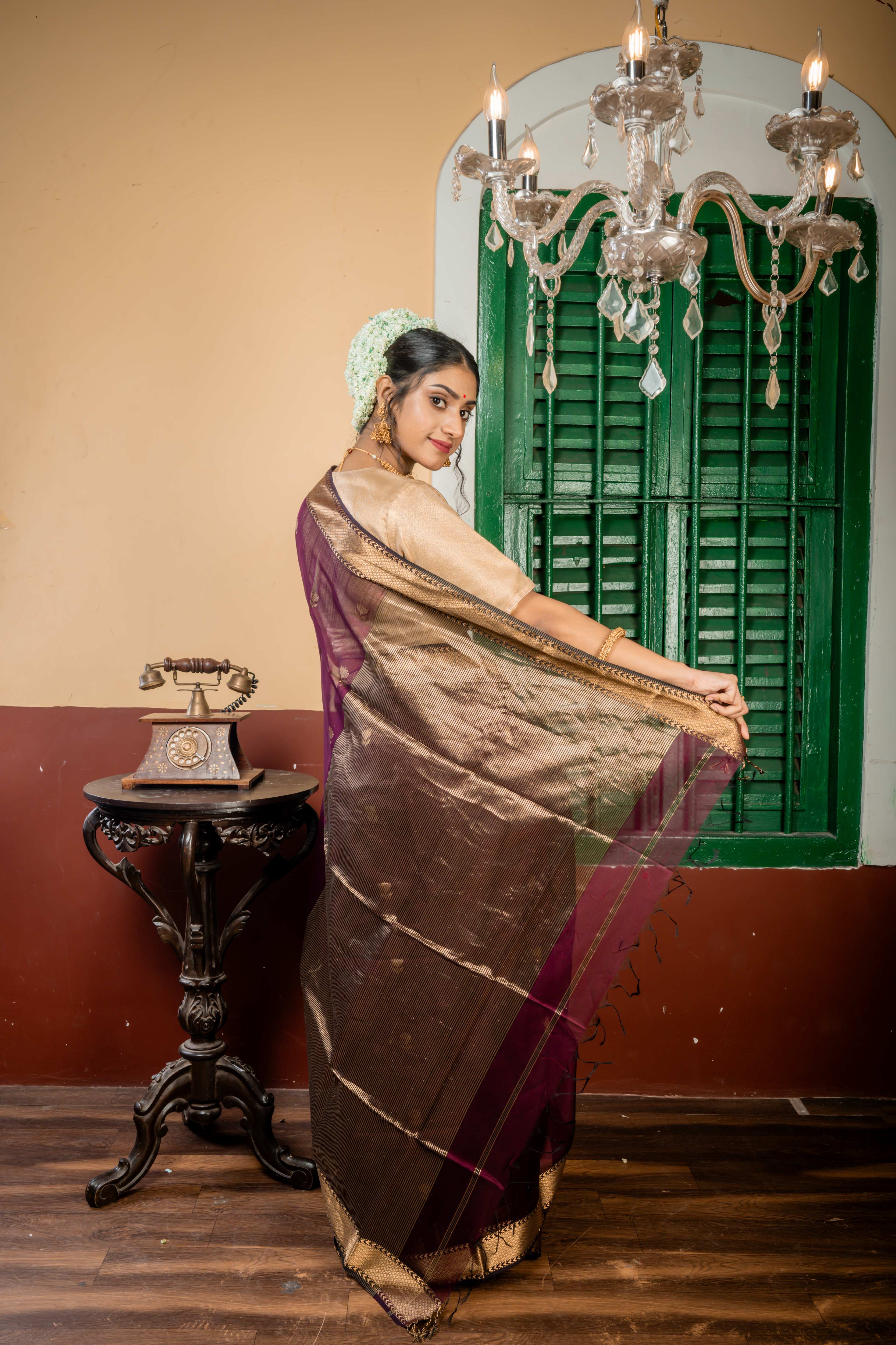 Sulochana || Wine Cotton Resham Maheshwari Handloom Saree with all over Antique Gold Zari Floral motif Buta, Black & Antique Gold Zari Brocade Border and Black & Antique Gold Stripe Pallu