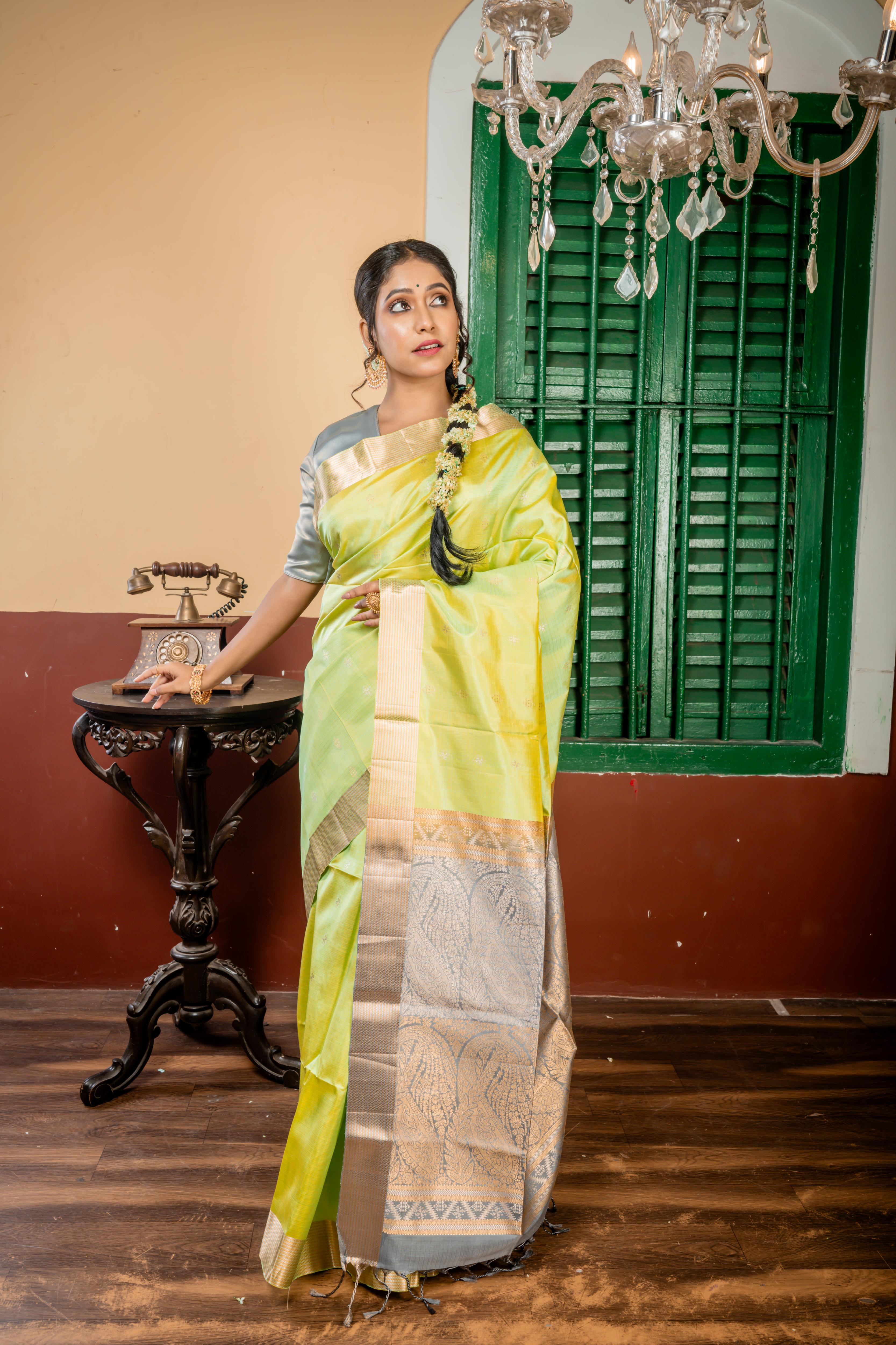 Nayanthara || Mint Green & Olive Yellow Striped Pattu Soft Silk Handloom Saree with all over Matte Gold & Antique Silver Zari Traditional Buta, Smokey Grey & Antique Gold Zari Border and Pallu with Antique Gold & Antique Silver Zari Traditional design