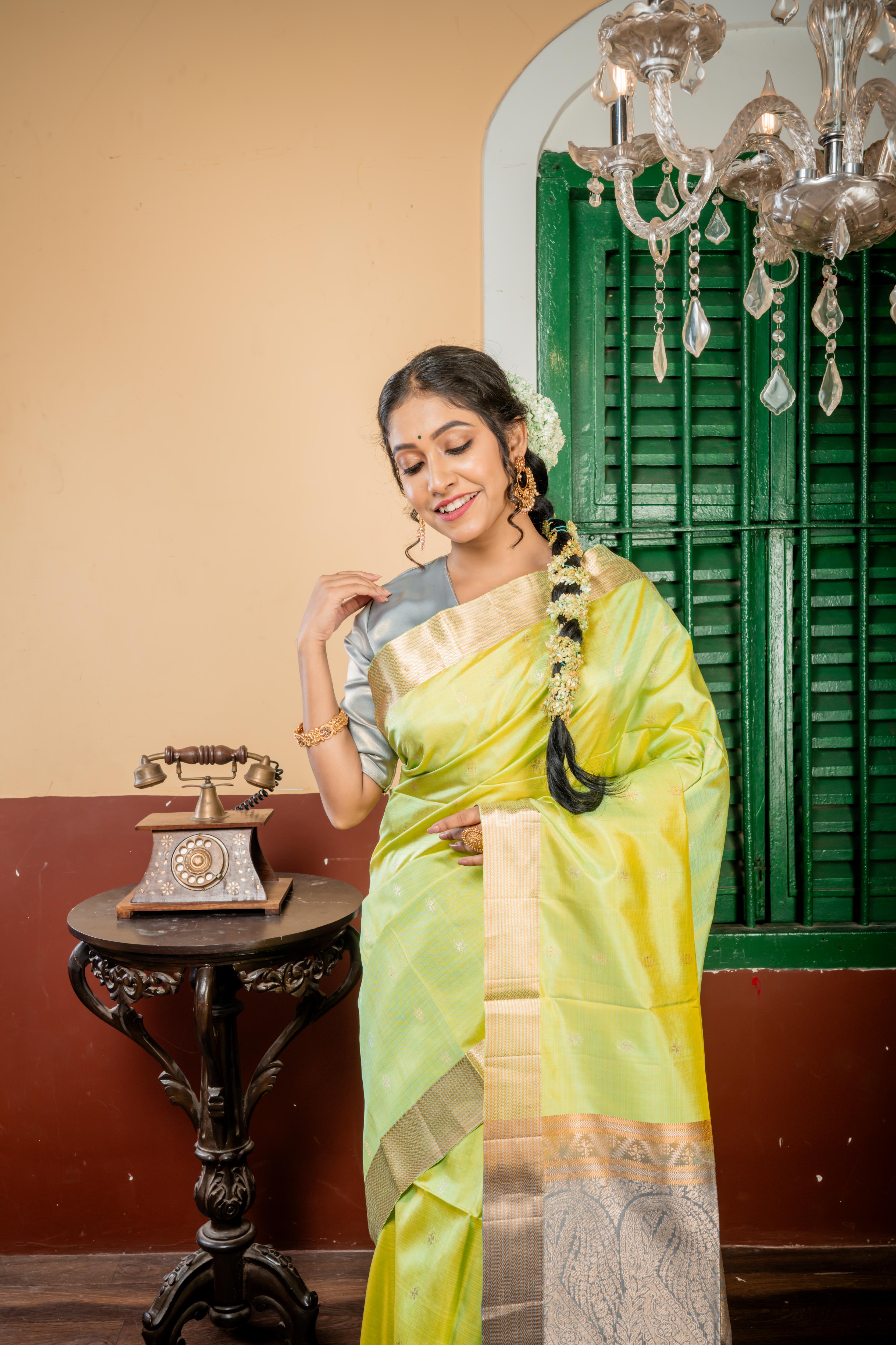 Nayanthara || Mint Green & Olive Yellow Striped Pattu Soft Silk Handloom Saree with all over Matte Gold & Antique Silver Zari Traditional Buta, Smokey Grey & Antique Gold Zari Border and Pallu with Antique Gold & Antique Silver Zari Traditional design