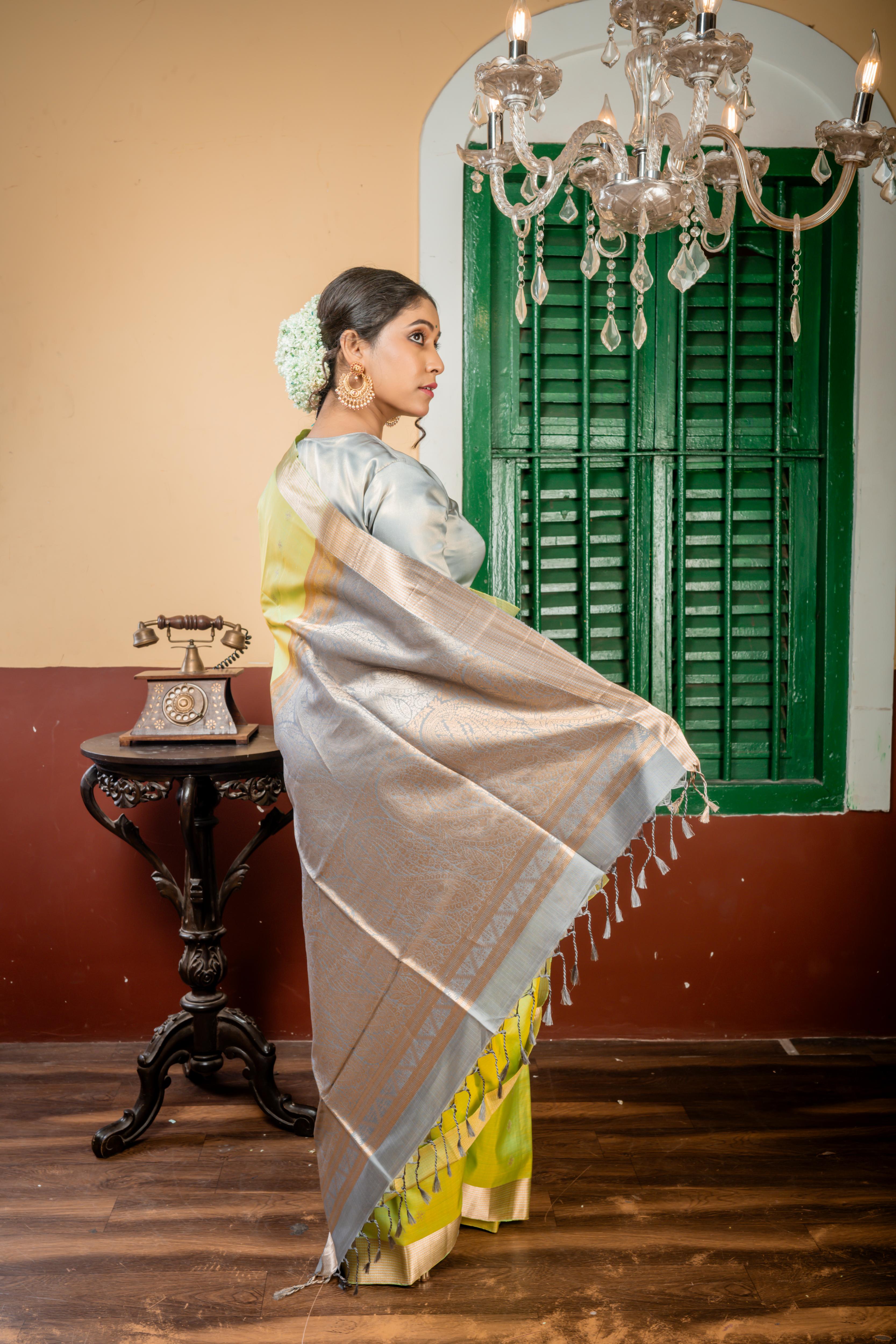 Nayanthara || Mint Green & Olive Yellow Striped Pattu Soft Silk Handloom Saree with all over Matte Gold & Antique Silver Zari Traditional Buta, Smokey Grey & Antique Gold Zari Border and Pallu with Antique Gold & Antique Silver Zari Traditional design