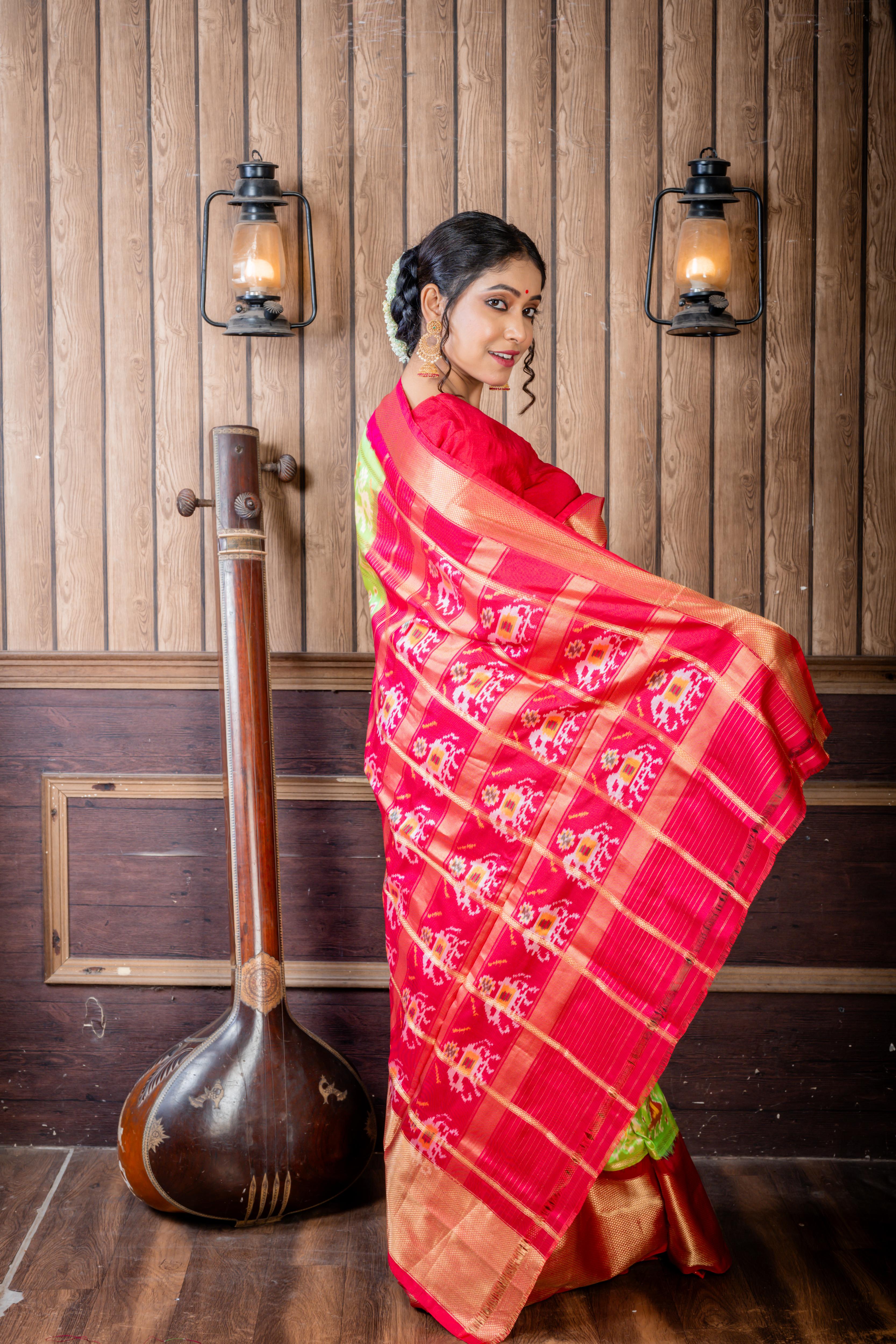 Vasundhara || Parrot Green Pure Silk Pochampally Handloom Saree with all over Multi-colour Ikkat design & Matte Gold Zari Checks, Beetroot Pink & Antique Gold Zari Traditional design Border & Pallu with Zari Checks highlights