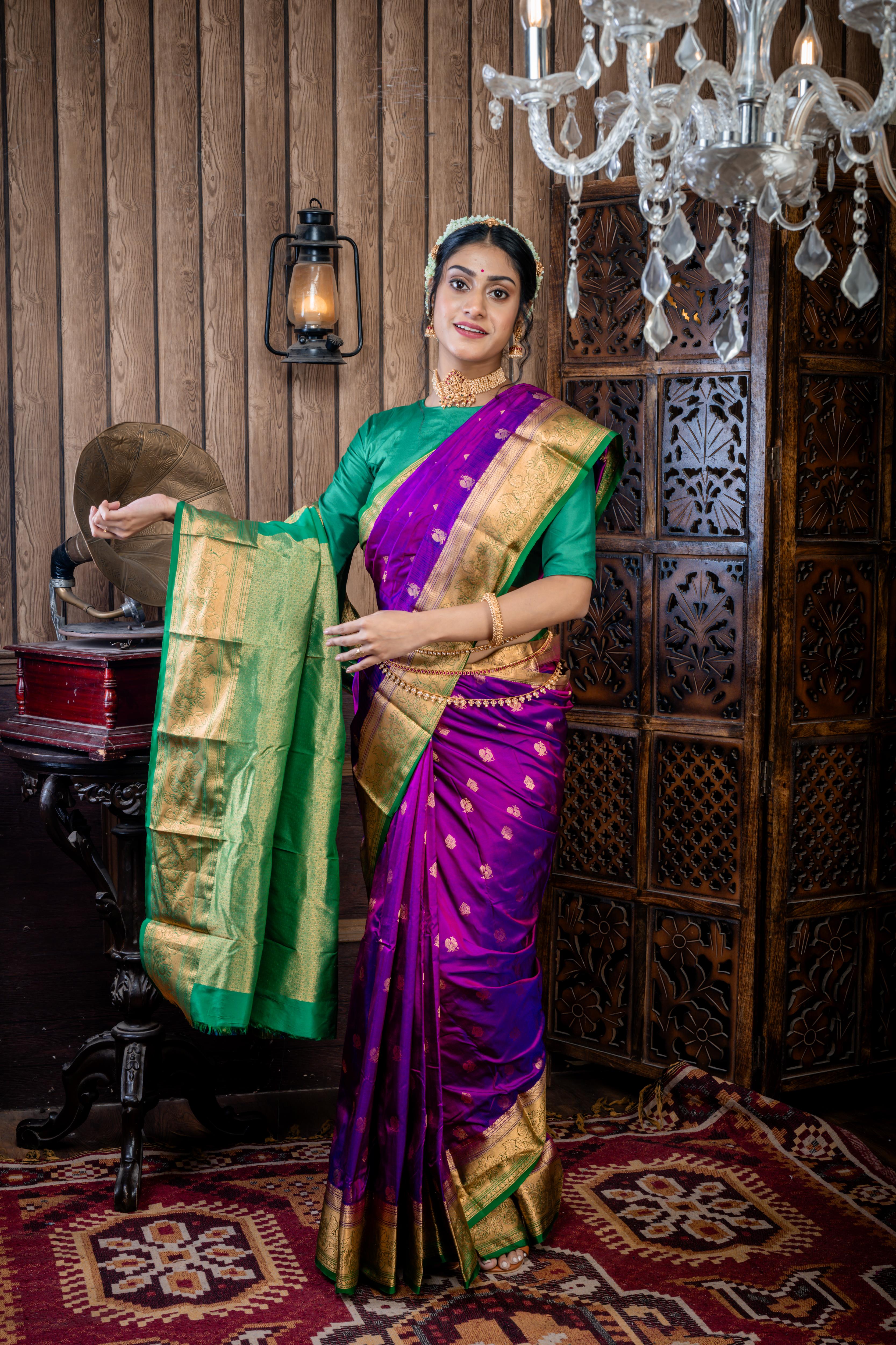 Maitri || Purple & Violet dual tone Pure Kanjivaram Silk Handloom Saree with all over Golden Zari 'Peacock' motif Buta, Dark Green broad & Golden Zari Border and traditional design Pallu