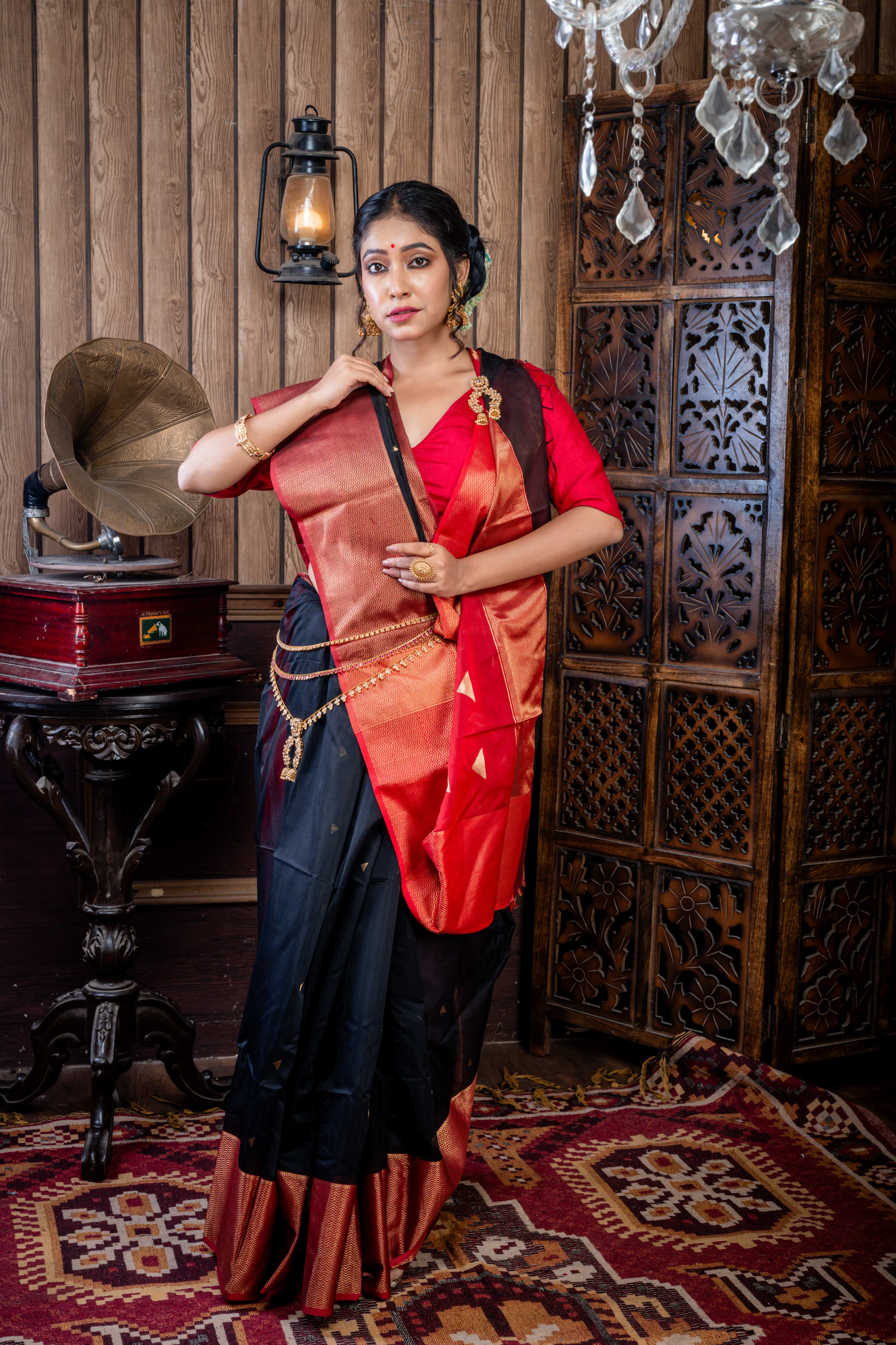 Nishita || Black Cotton Resham Maheshwari Handloom Saree with all over Antique Gold Zari Buta, Dark Garnet Red & Antique Gold Zari Brocade Border and Dark Garnet Red Pallu with Antique Gold Zari Stripe & Copper Buta