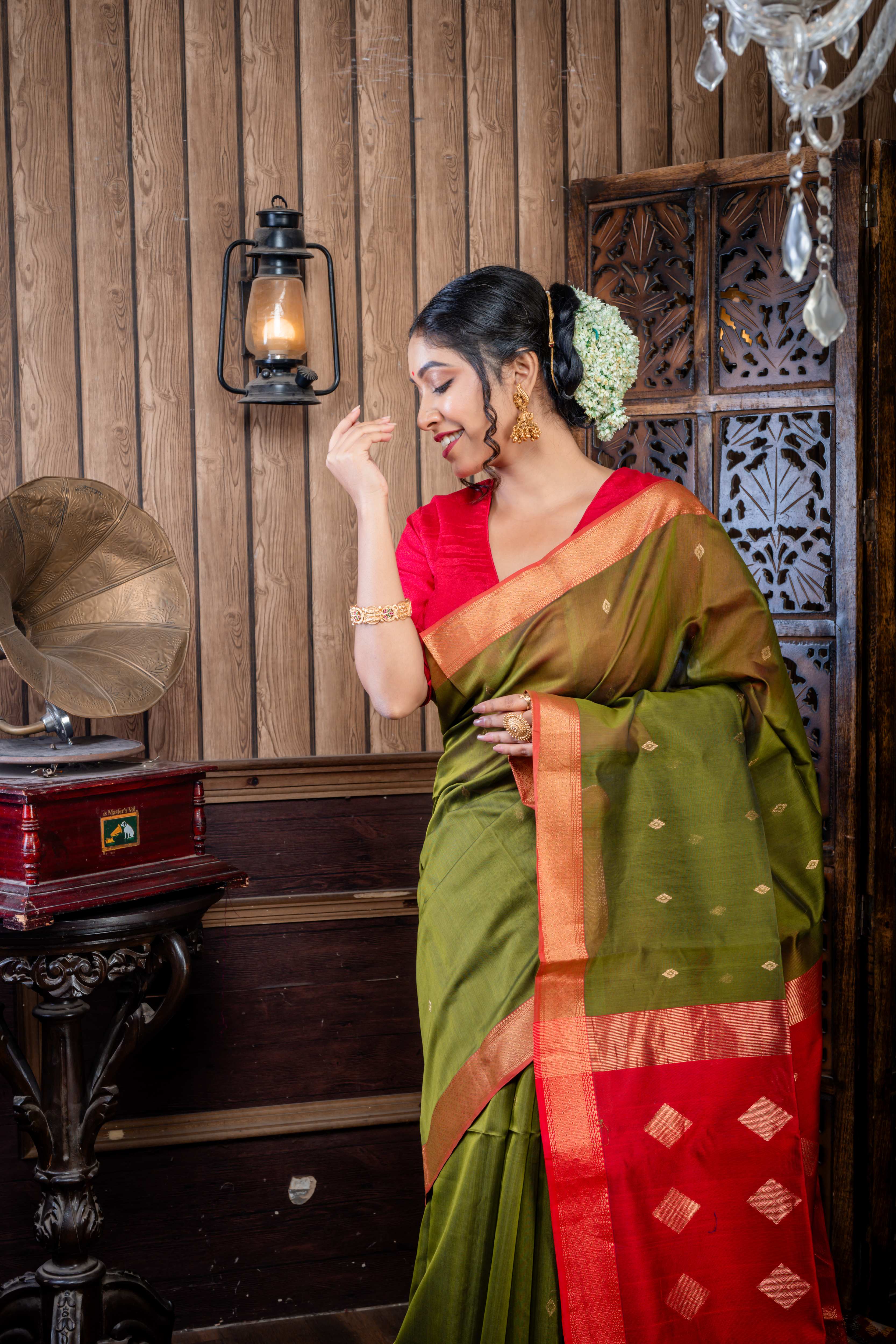 Vidushi || Dark Moss Green Cotton Resham Maheshwari Handloom Saree with all over Matte Gold Zari Buta, Red Clay & Antique Gold Zari Brocade Border and Red & Antique Gold Pallu with Stripe & Traditional Motif