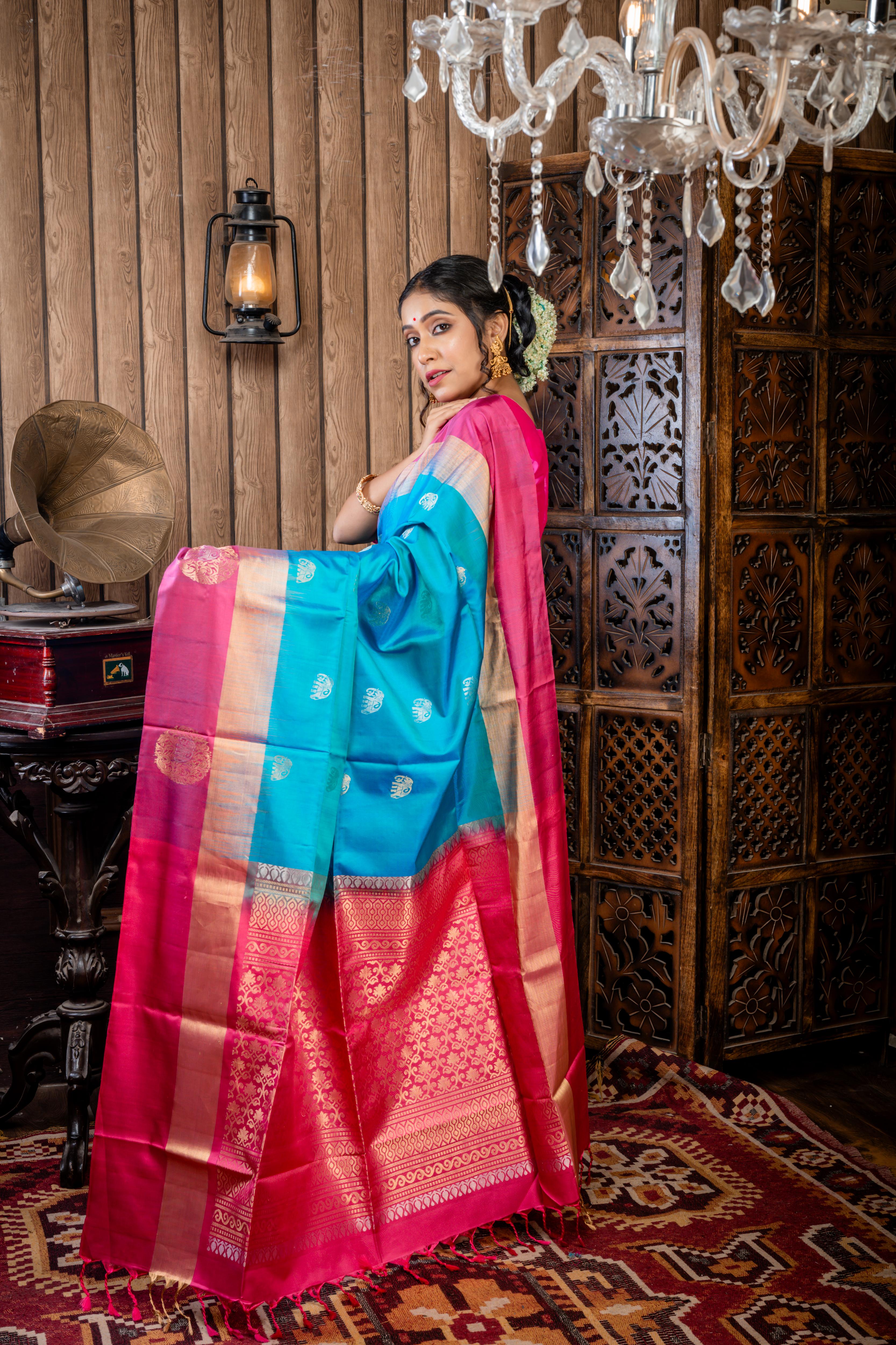 Iravathi || Turquoise Blue & Green dual tone Pattu Soft Silk Handloom Saree with all over Antique Gold & Silver Zari 'Elephant' motif Buta, Light Ruby Pink with 'Sona Rupa' Zari 'Elephant' motif & Antique Gold Zari Plain Border and Pallu