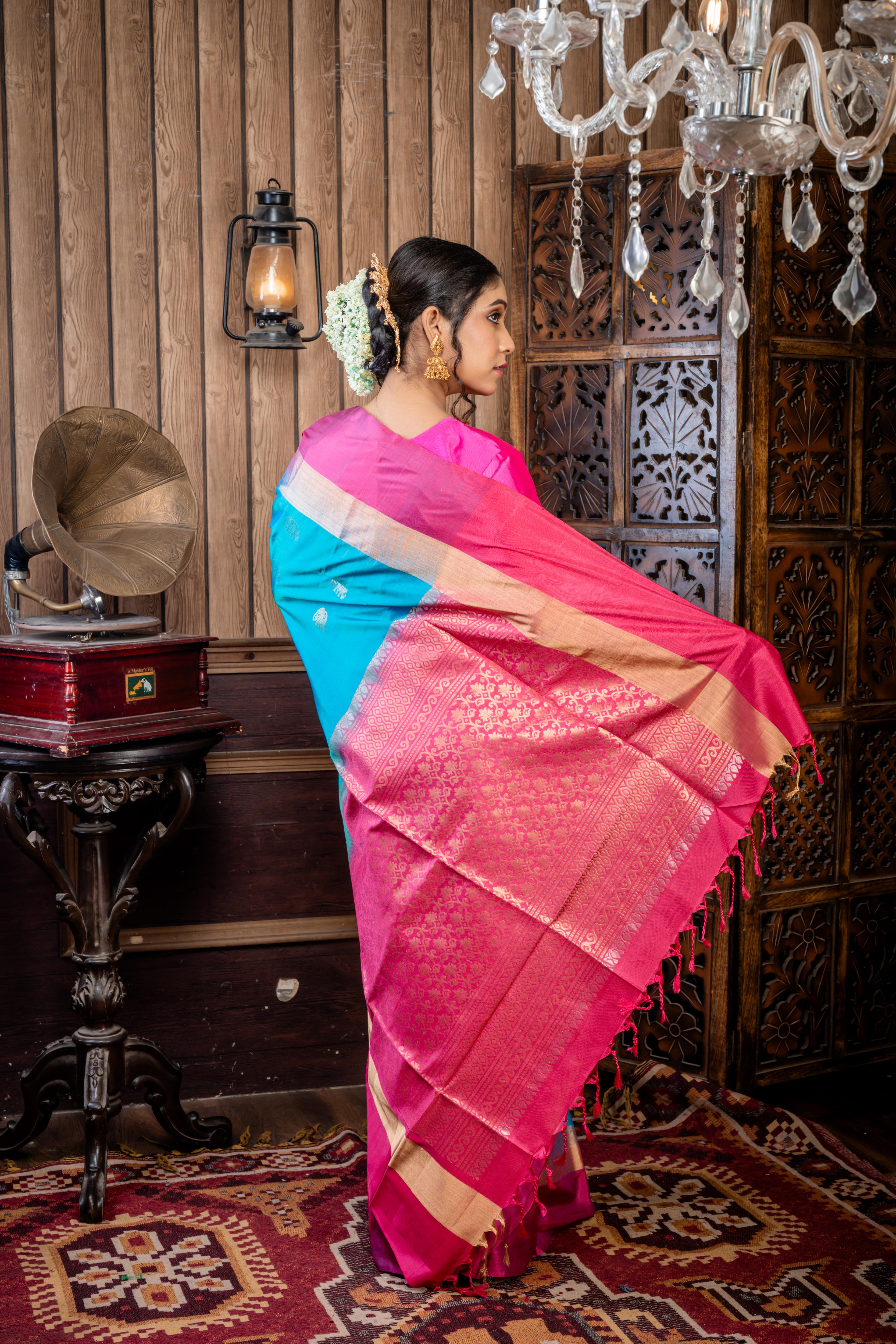 Iravathi || Turquoise Blue & Green dual tone Pattu Soft Silk Handloom Saree with all over Antique Gold & Silver Zari 'Elephant' motif Buta, Light Ruby Pink with 'Sona Rupa' Zari 'Elephant' motif & Antique Gold Zari Plain Border and Pallu