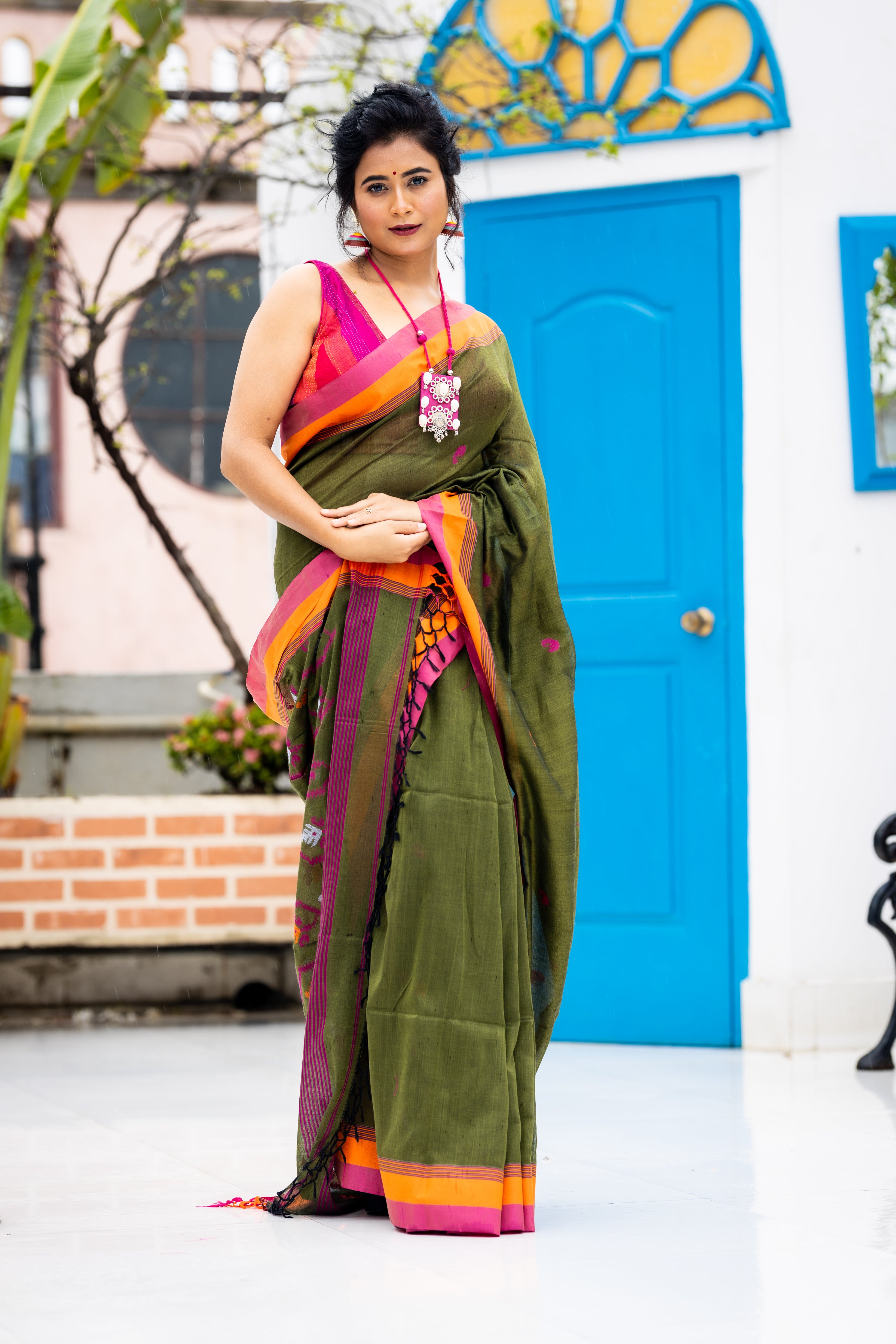 Tamalika || Dark Moss Green Cotton Bengal Handloom Saree with Half Body Plain, Half body Multi-colour Buta, Jamdani Pallu and Orange & Light Onion Pink border