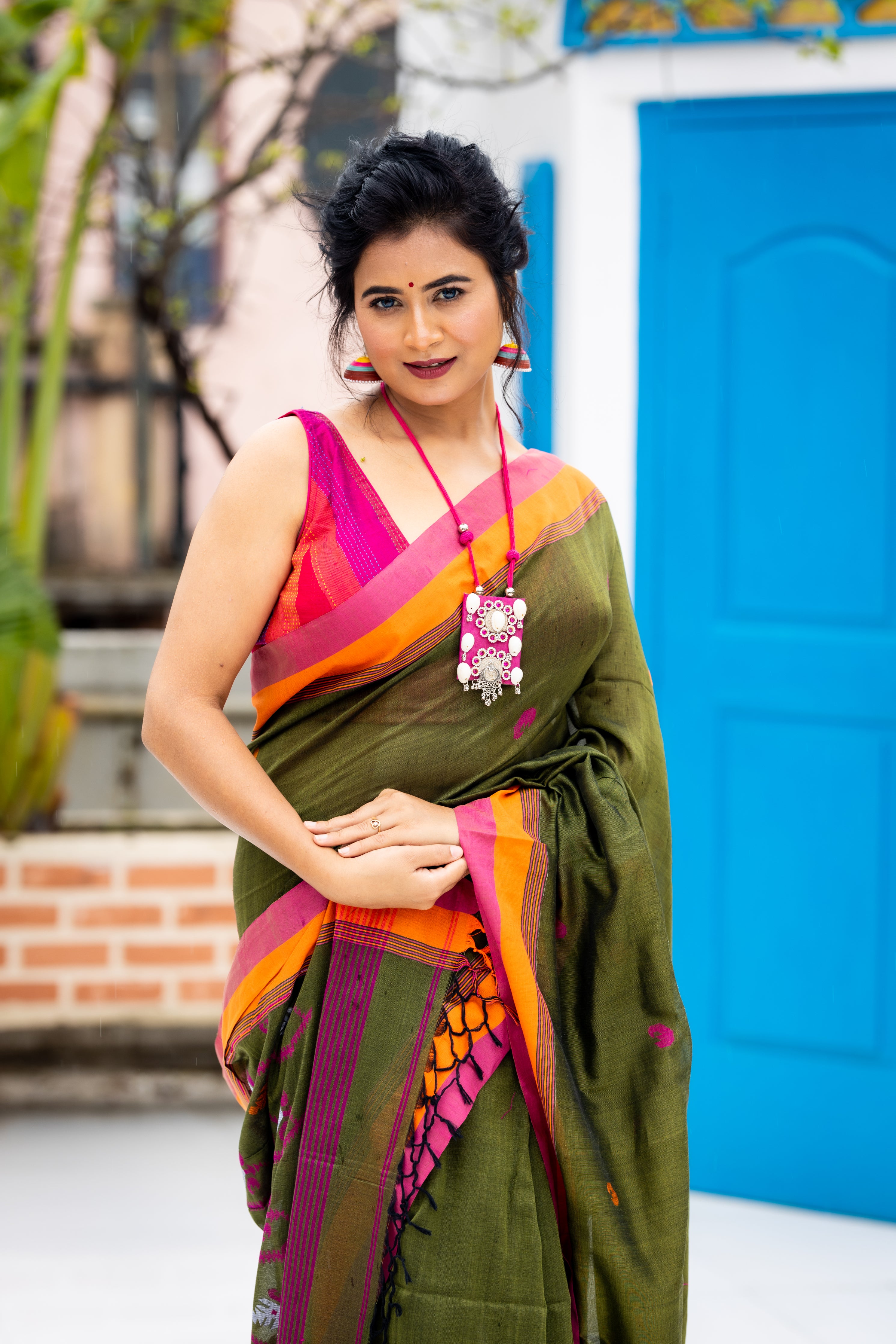 Tamalika || Dark Moss Green Cotton Bengal Handloom Saree with Half Body Plain, Half body Multi-colour Buta, Jamdani Pallu and Orange & Light Onion Pink border