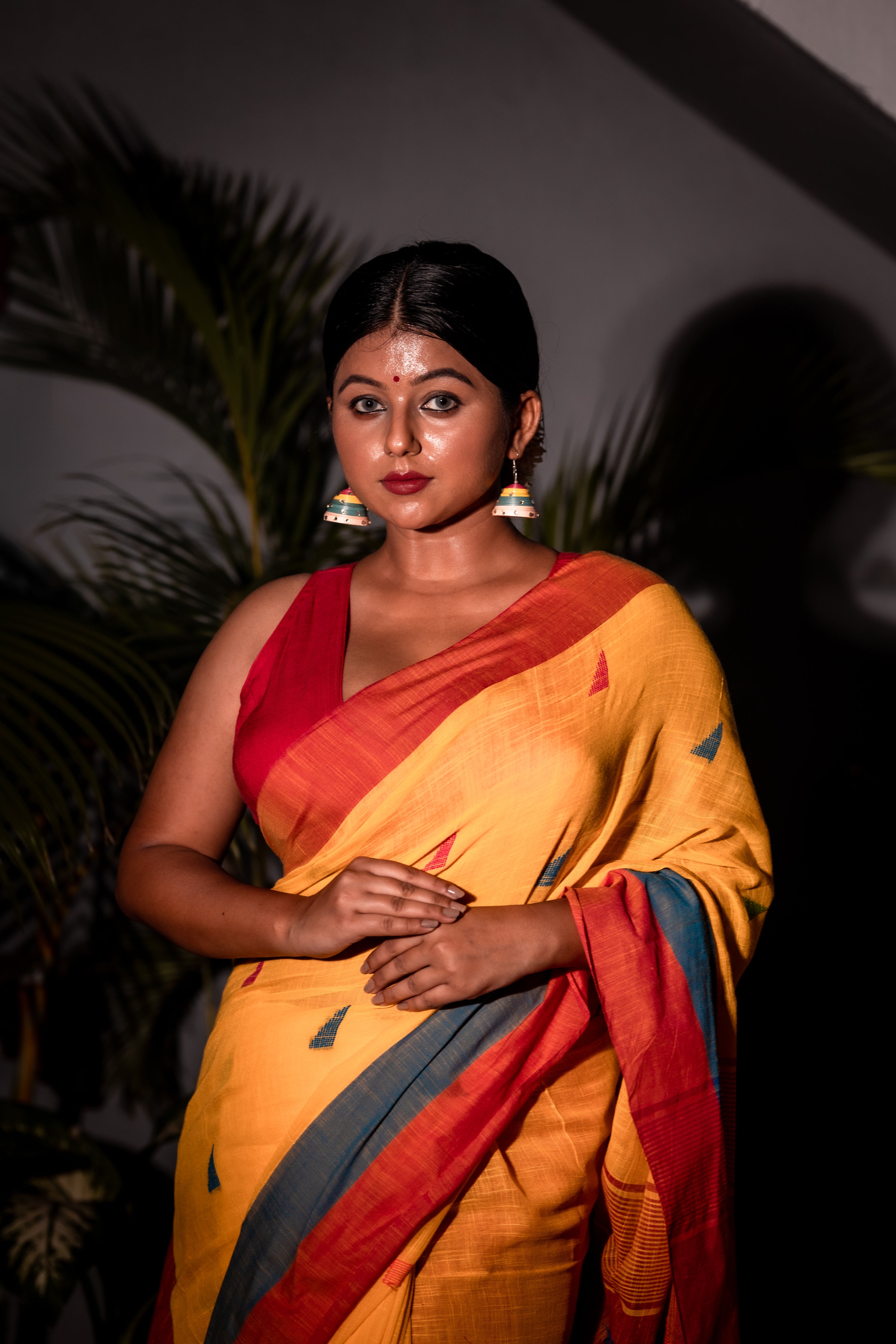 Tribeni || Turmeric Yellow Cotton Bengal Handloom Saree with all over Multi-colour Buta, Dusty Blue & Beet Red Border and 'Temple' motif Pallu