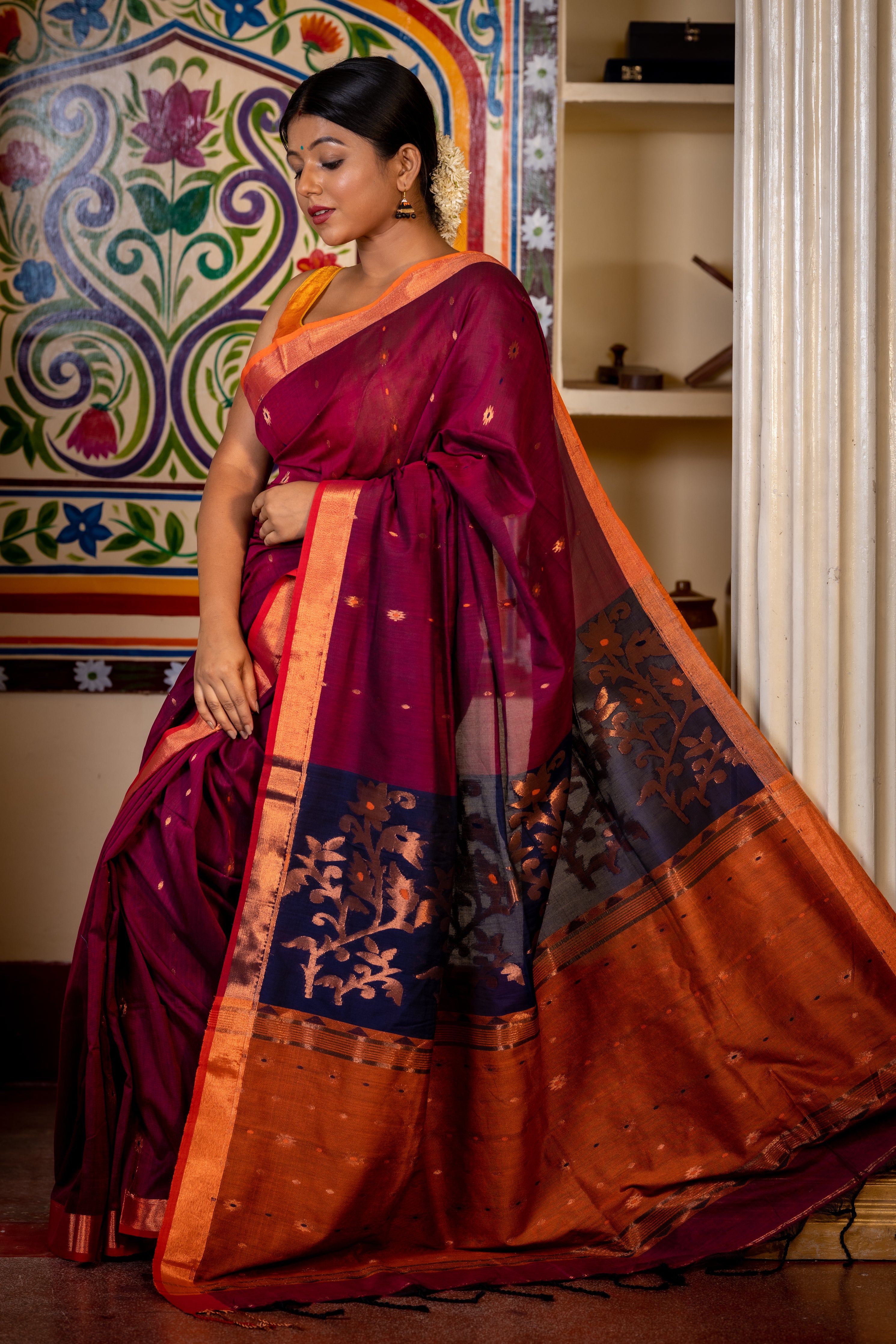 Jamuni || Wine Cotton Bengal Handloom Saree with all over Copper Zari & Multi-colour Buti, Navy Blue & Rust Orange Colour block with Copper Zari Floral motif Pallu and Plain Border