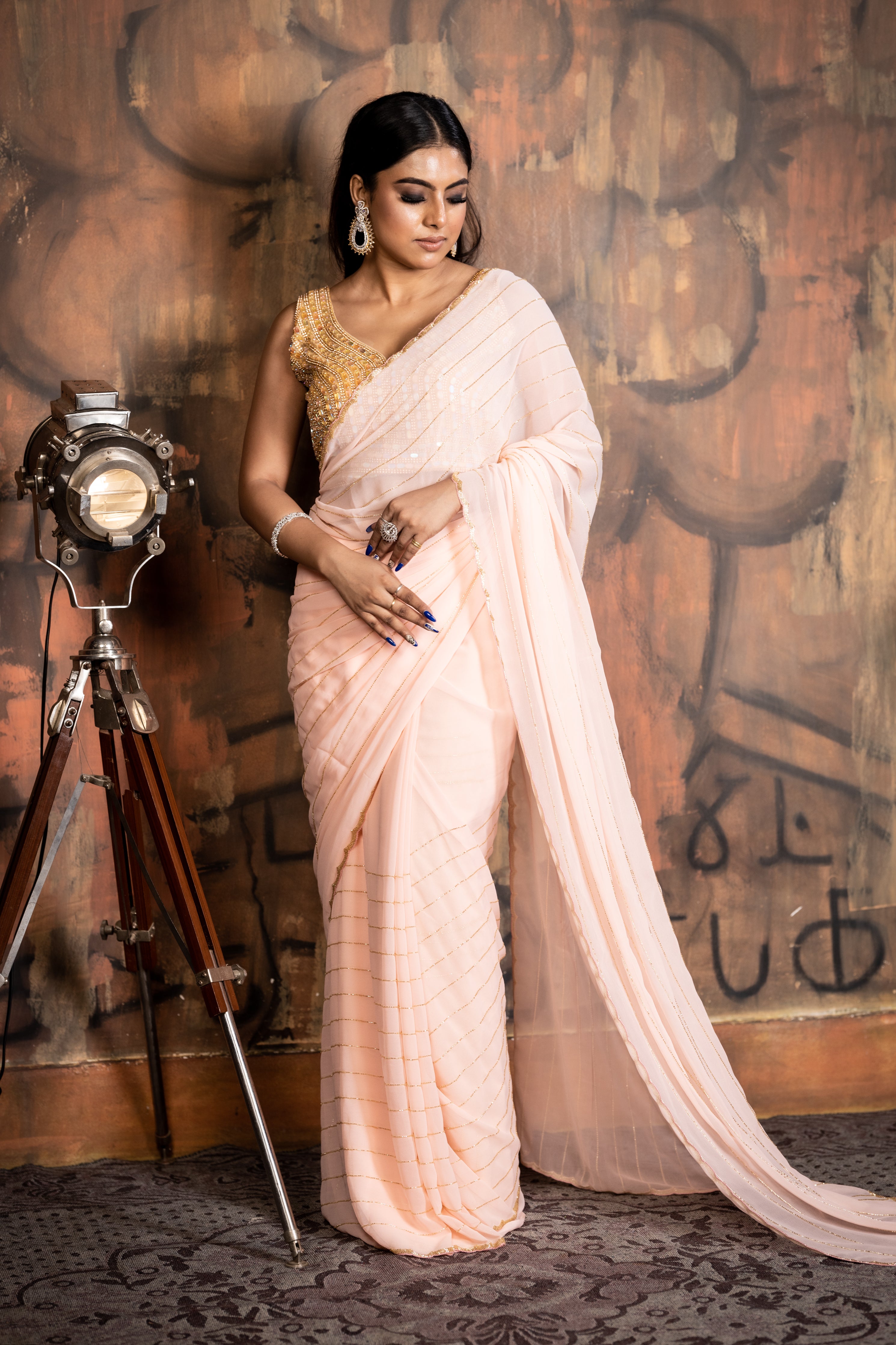 Peachy Vibes || Bright Peach Georgette Chiffon Fancy Saree with all over Golden Cut-dana Handwork Stripes and Border