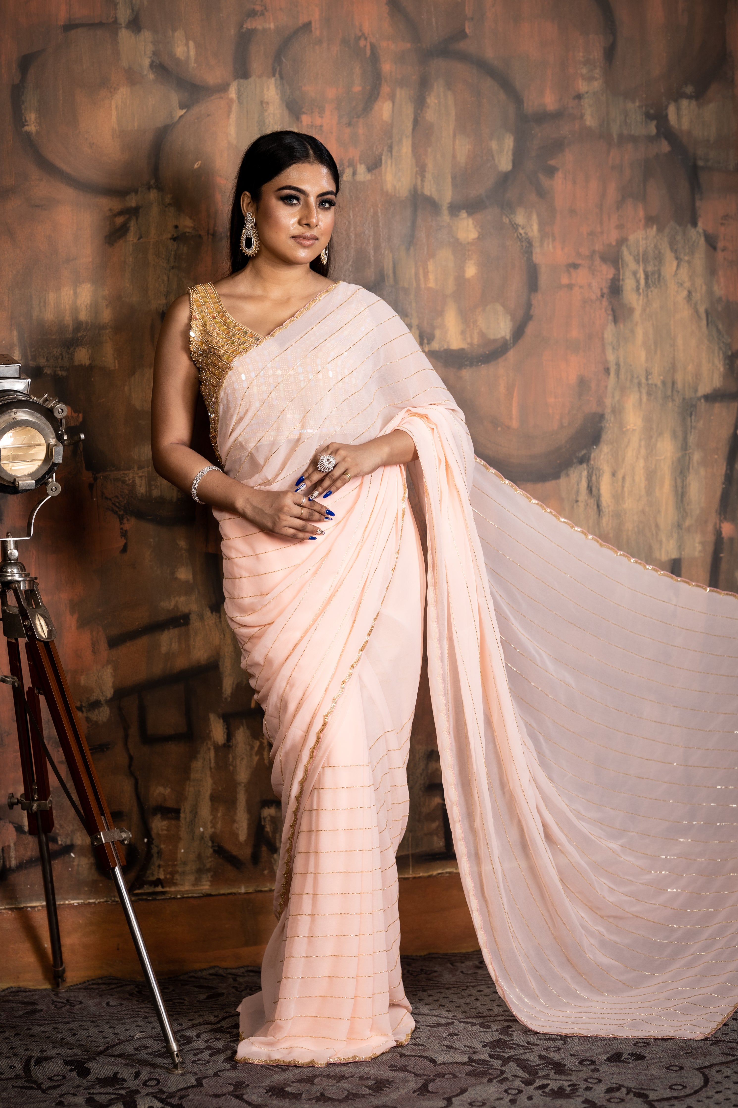 Peachy Vibes || Bright Peach Georgette Chiffon Fancy Saree with all over Golden Cut-dana Handwork Stripes and Border