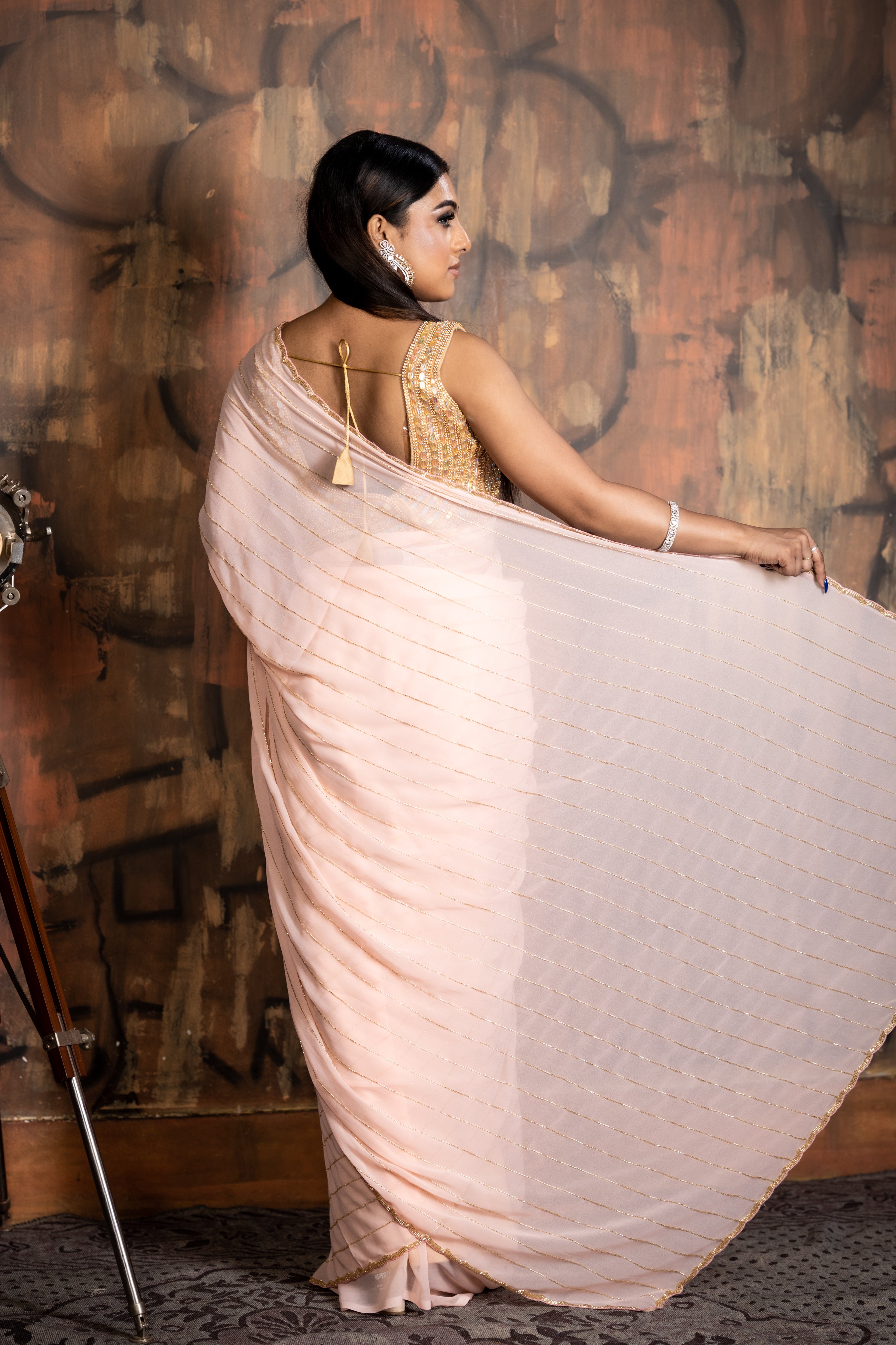 Peachy Vibes || Bright Peach Georgette Chiffon Fancy Saree with all over Golden Cut-dana Handwork Stripes and Border
