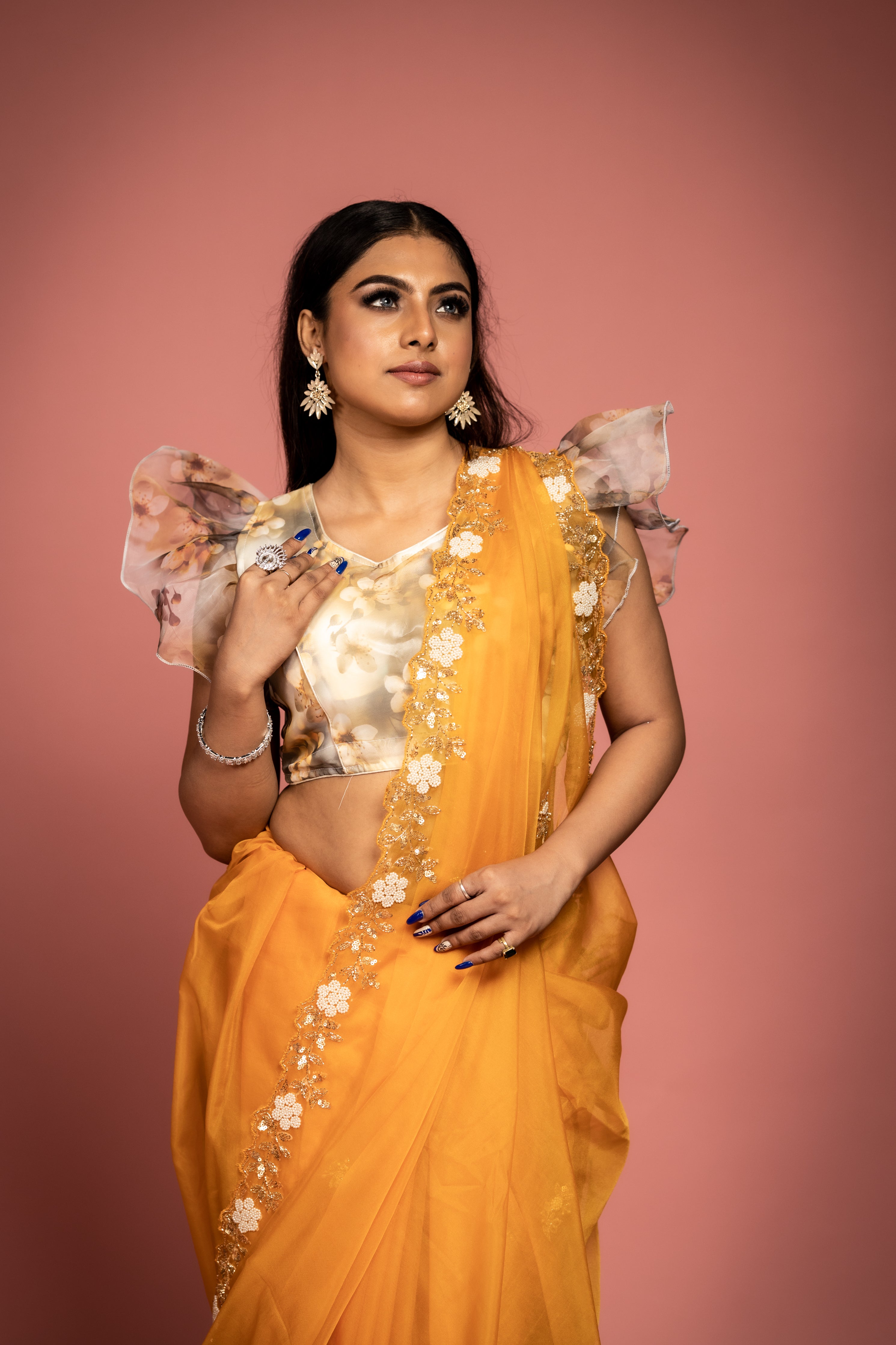 Kesariya || Saffron Soft Organza Fancy Saree with all over Antique Gold Cut-dana, Sequins & White Moti Handwork Floral motif Buta and Border