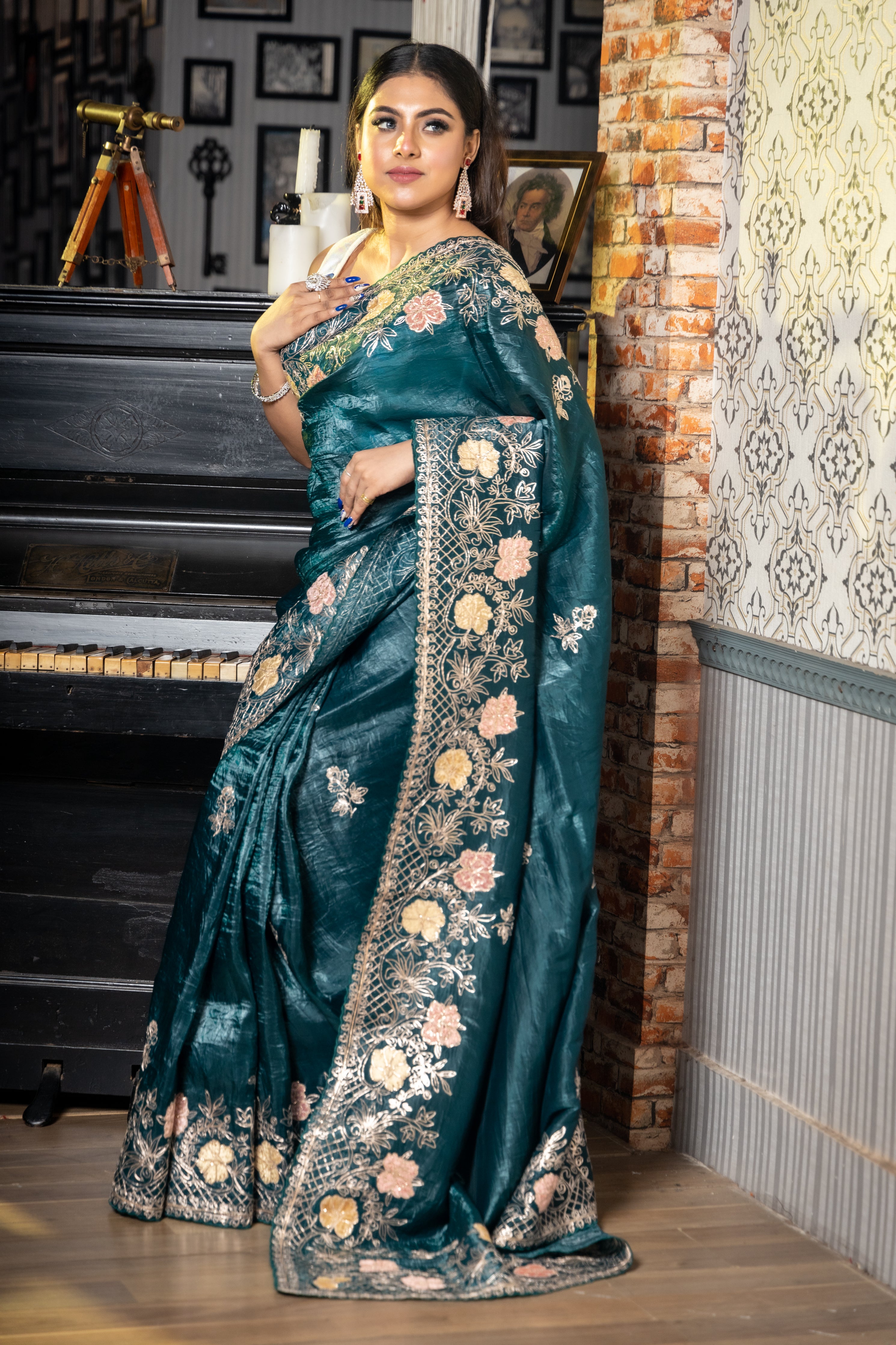 Aurora || Dark Metallic Ocean Green & Black dual tone Crushed Soft Tissue Fancy Saree with all over Pitta Zari Handwork Floral Buta and Multi-colour Applique & Pitta Zari Floral Jaal Border