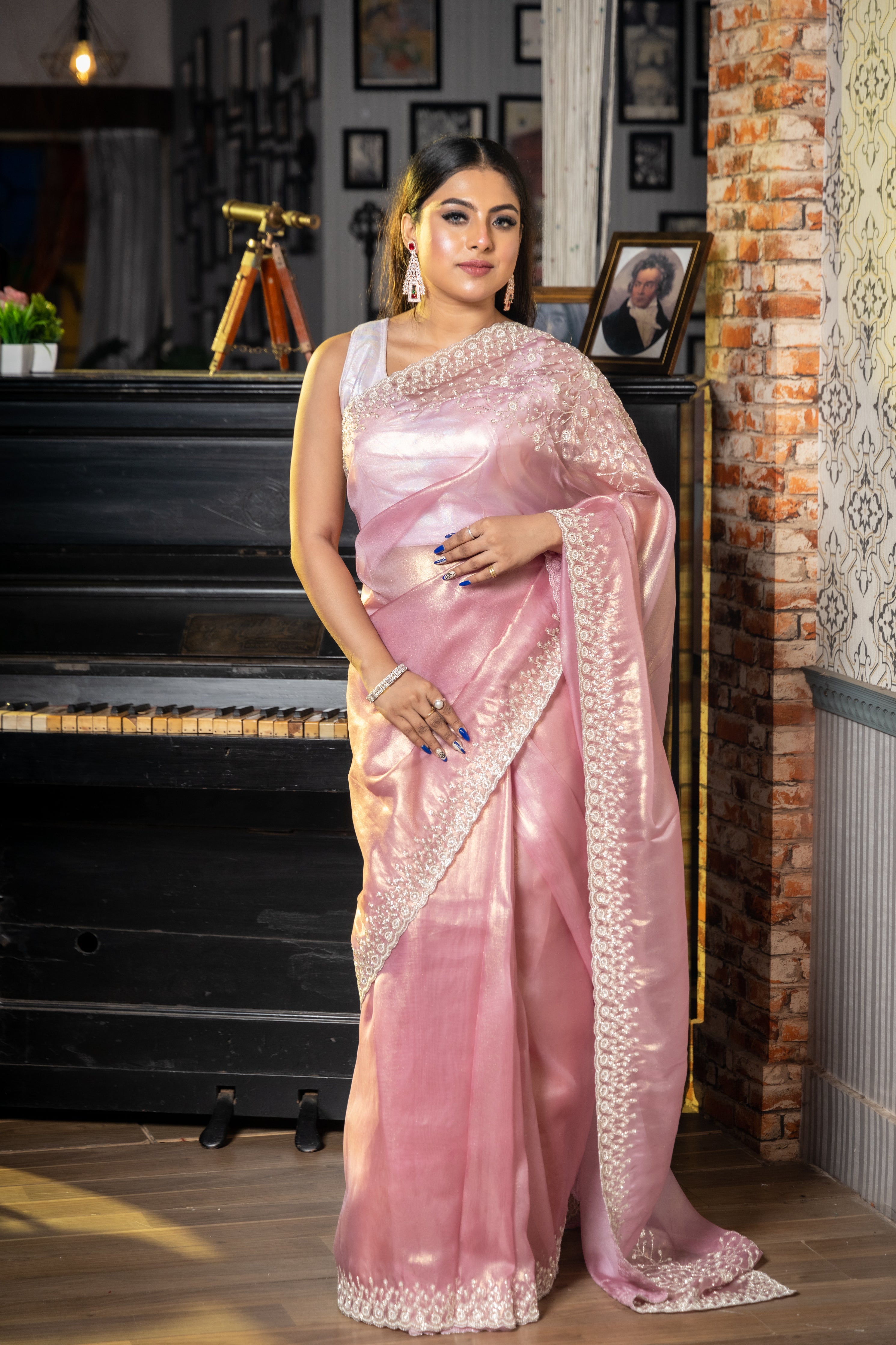 Panache || Onion Pink & Gold dual tone Raina Tissue Fancy Saree with all over Plain body and Silver Cut-dana, Moti & Stone  Handwork Floral Border