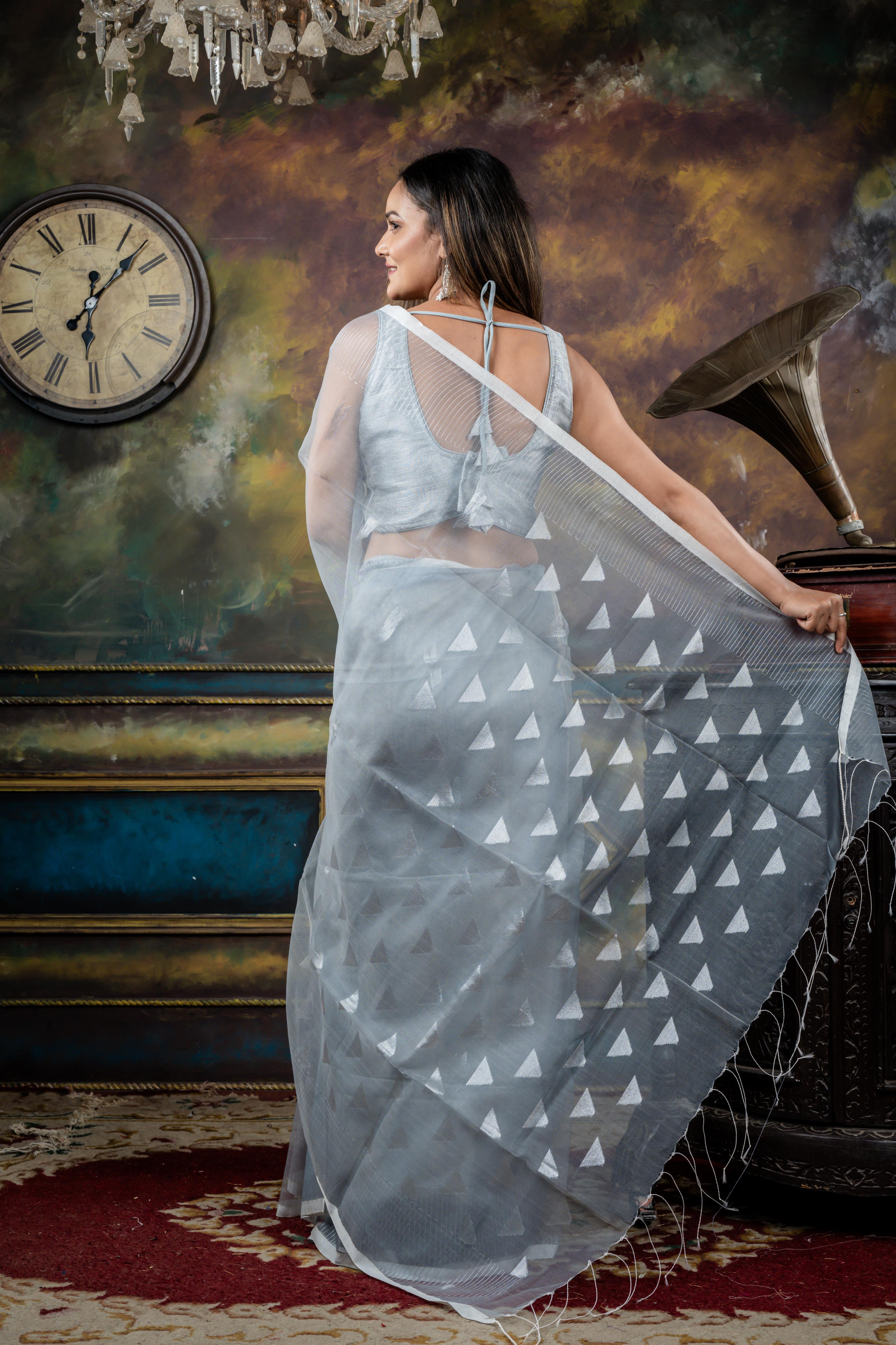 Jyotsna || Grey Muslin Saree with all over Silver Zari Abstract Buta, Stripe Border and 'Temple' motif Pallu