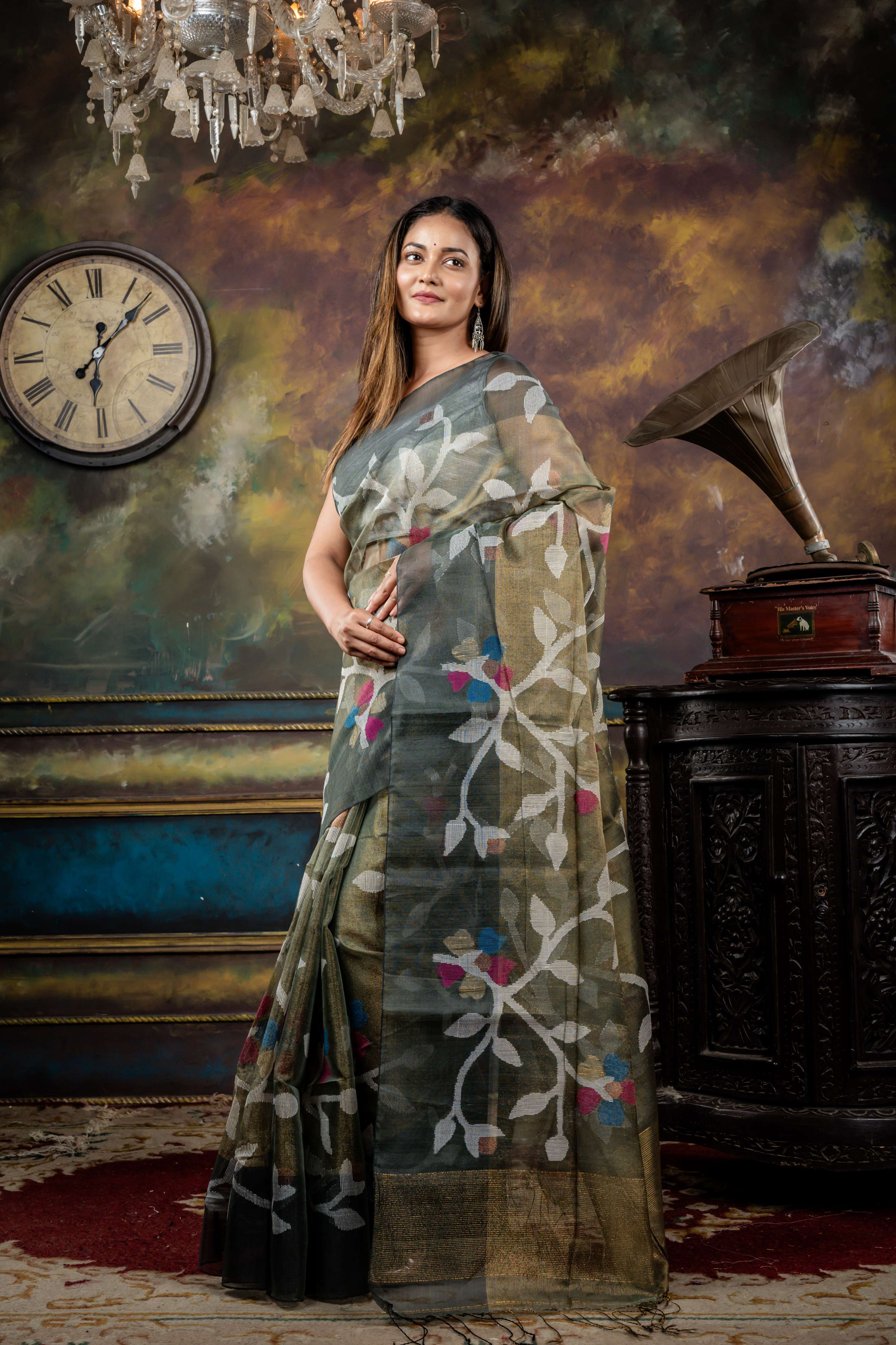 Keya || Sage Green & Antique Gold dual tone Premium Tissue Muslin Bengal Handloom Saree with all over Multi-colour & Copper Zari Floral Jamdani Body & Pallu and Dark Grey 'Mahapadh' Border