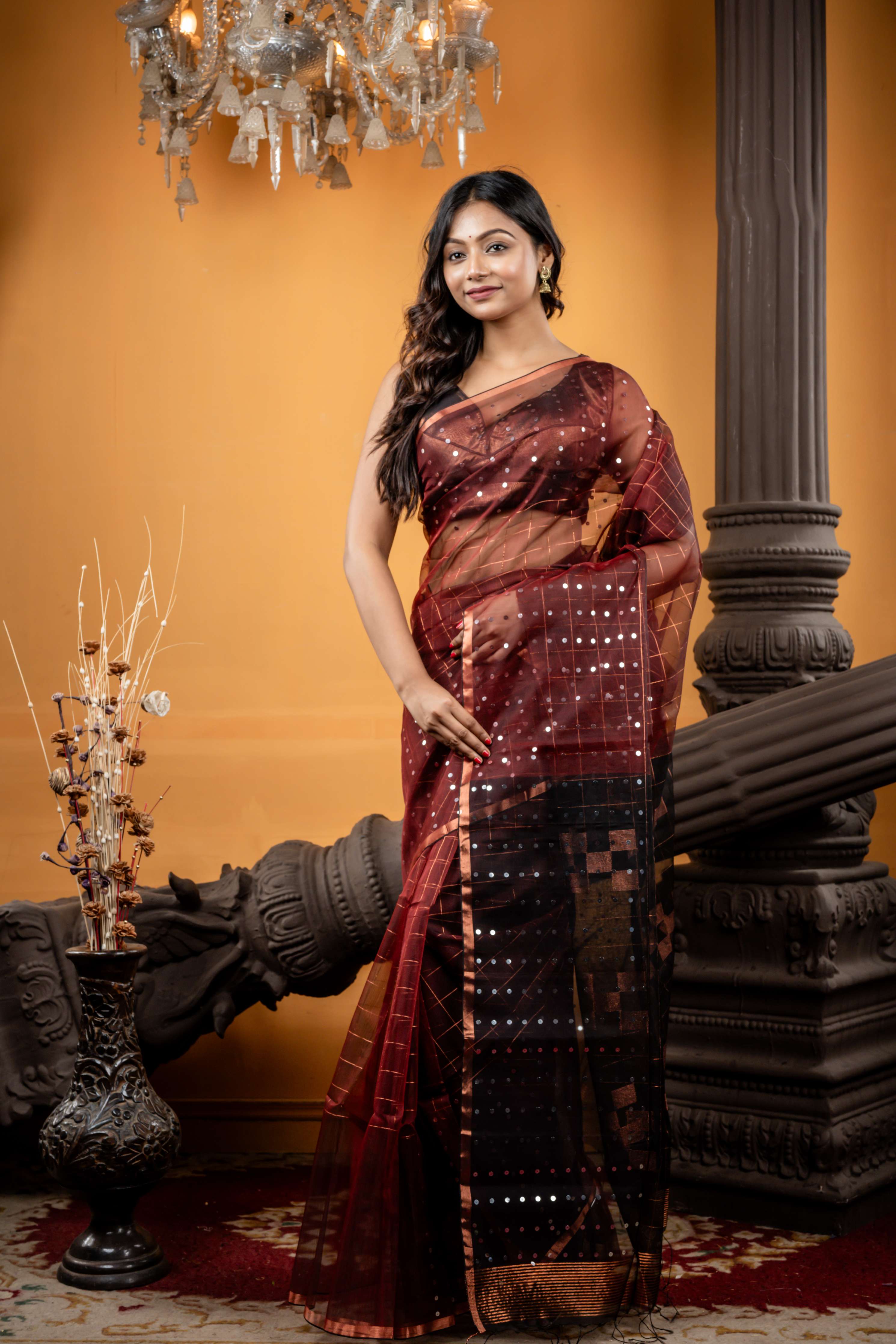 Jhilmil || Rosewood Brown Muslin Bengal Handloom Saree with all over Copper Checks, half body Sequins highlights, half body Plain Black Border and Copper Checks with Sequins highlights Pallu