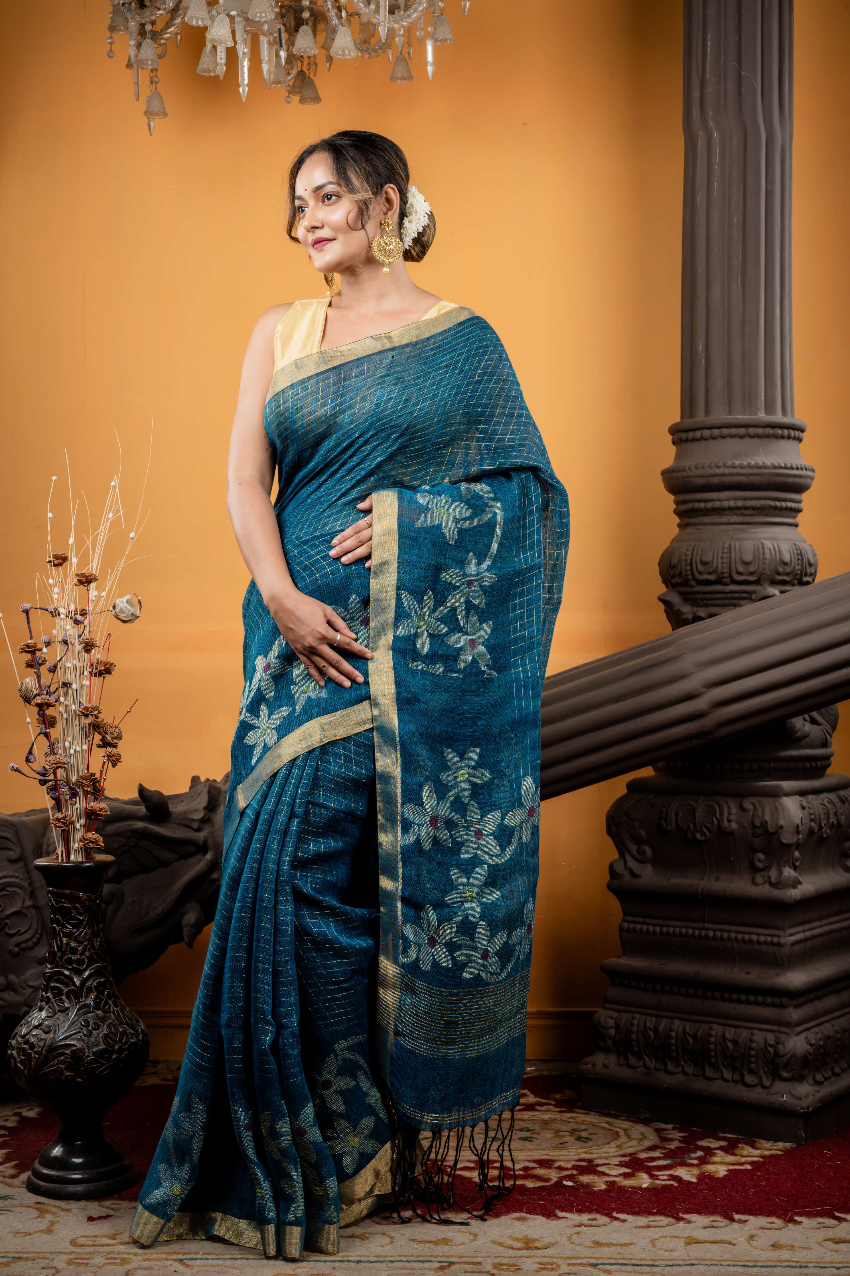 Shalini || Peacock Blue & Black dual tone Linen Bengal Handloom Saree with all over Golden Zari Checks & Floral Pallu with Multi-colour Buti and Antique Gold Zari Border