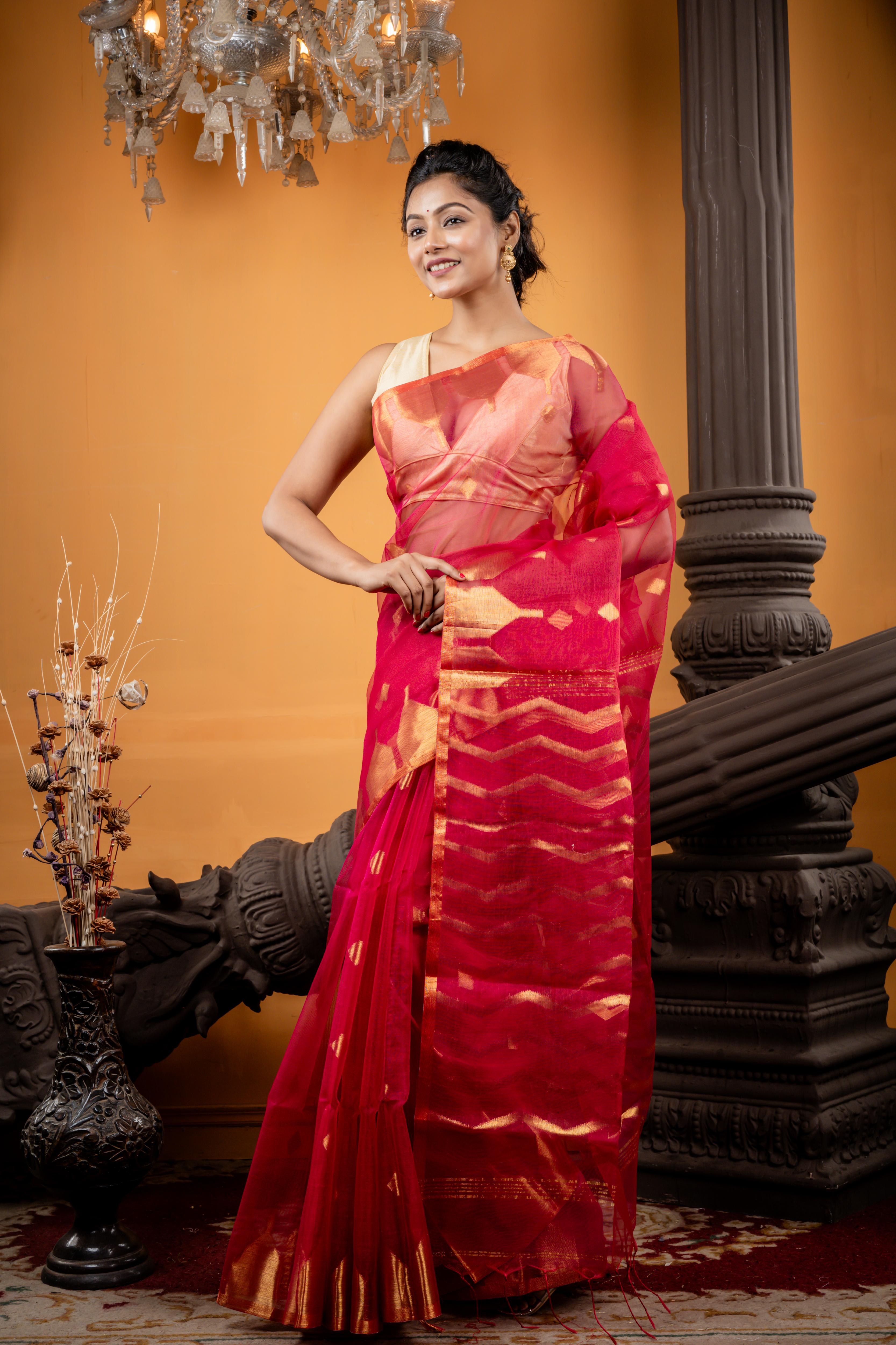 Nabarupa || Magenta Pink Muslin Saree with all over Golden Zari Abstract Buta, ZigZag Stripe Pallu and Sleek Border with 'Temple' motifs