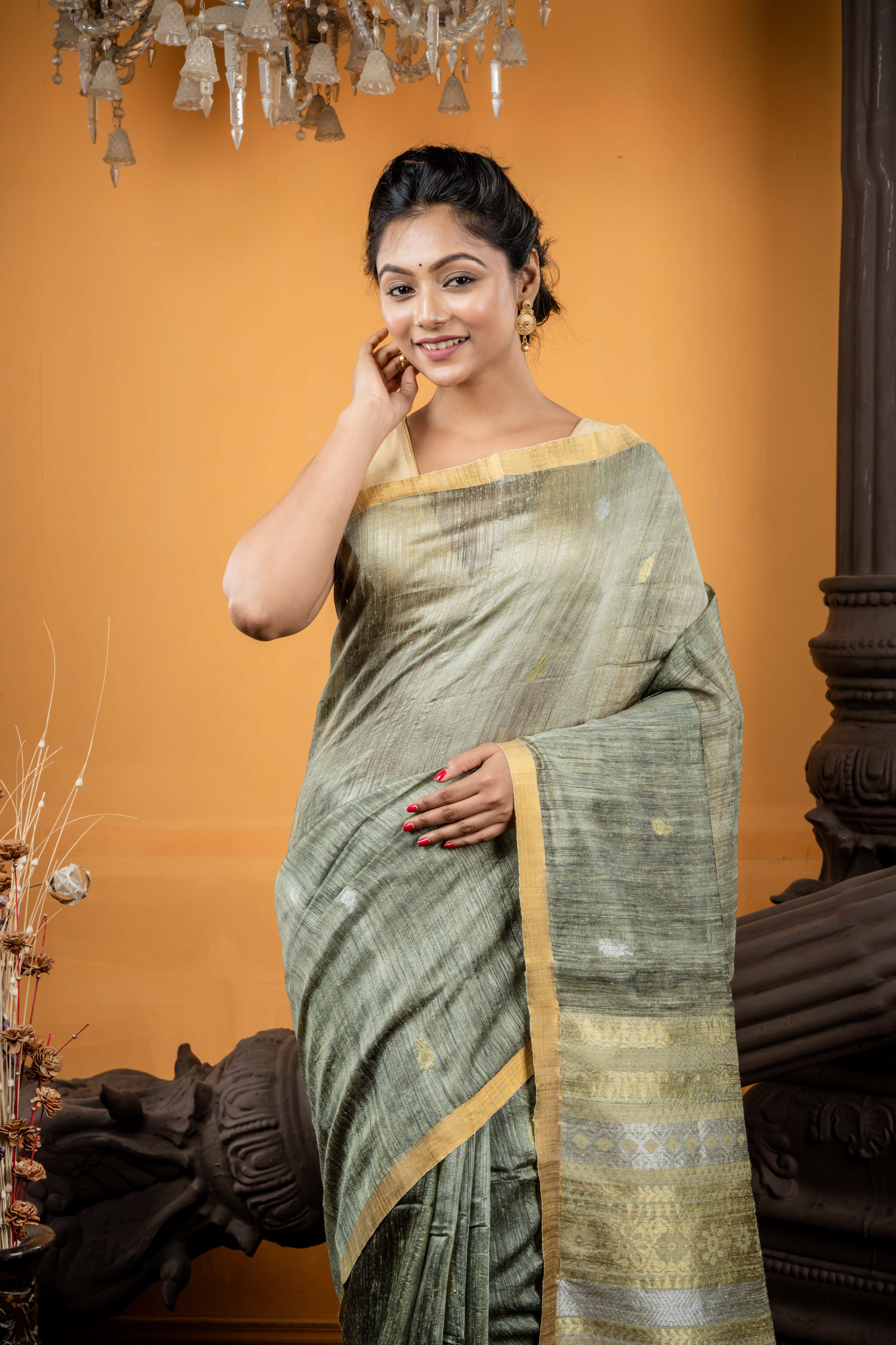 Somlata || Light Sage Green Premium Matka Bengal Handloom Saree with all over 'Sona Rupa' Zari Buta and 'Baluchori' design Stripe Pallu