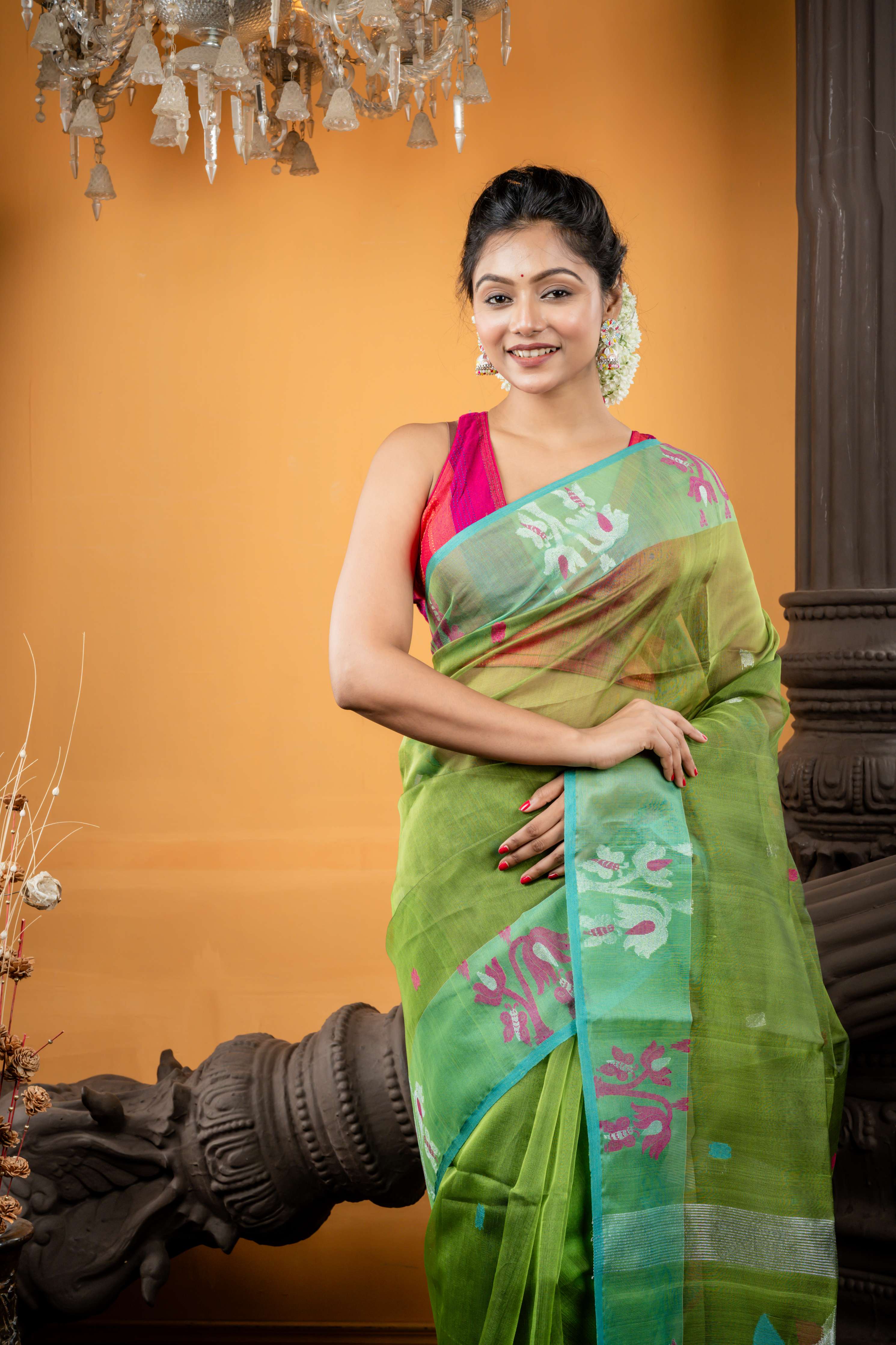 Triparna || Sap Green Premium Muslin Bengal Handloom Saree with all over Multi-colour & Silver Zari Buta and Parrot Green Jamdani Floral motif Border & Pallu