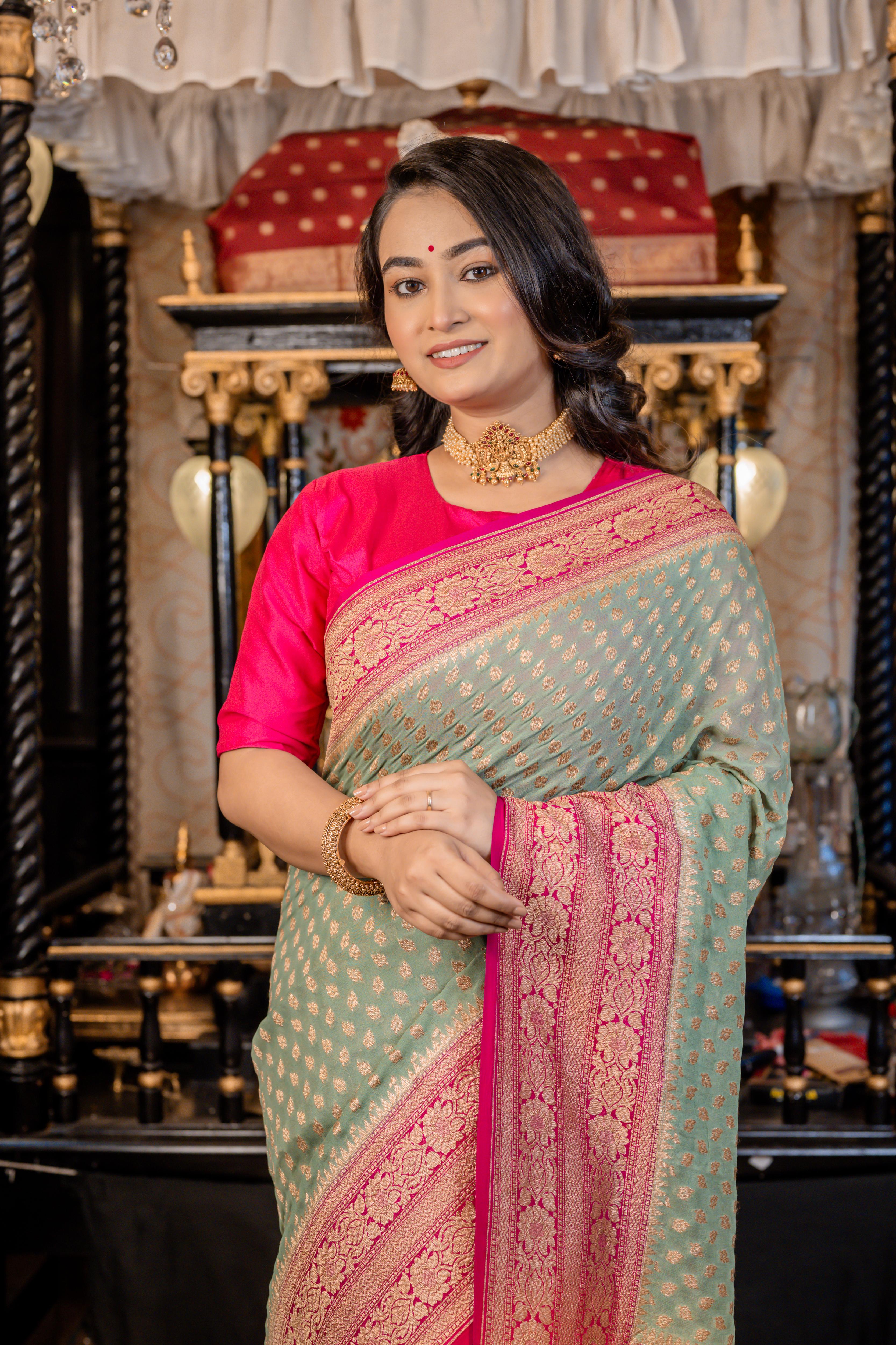 Nirvi || Dusty Teal Khaddi Georgette Banarasi Saree with all over Antique Zari Buti and Magenta Pink border