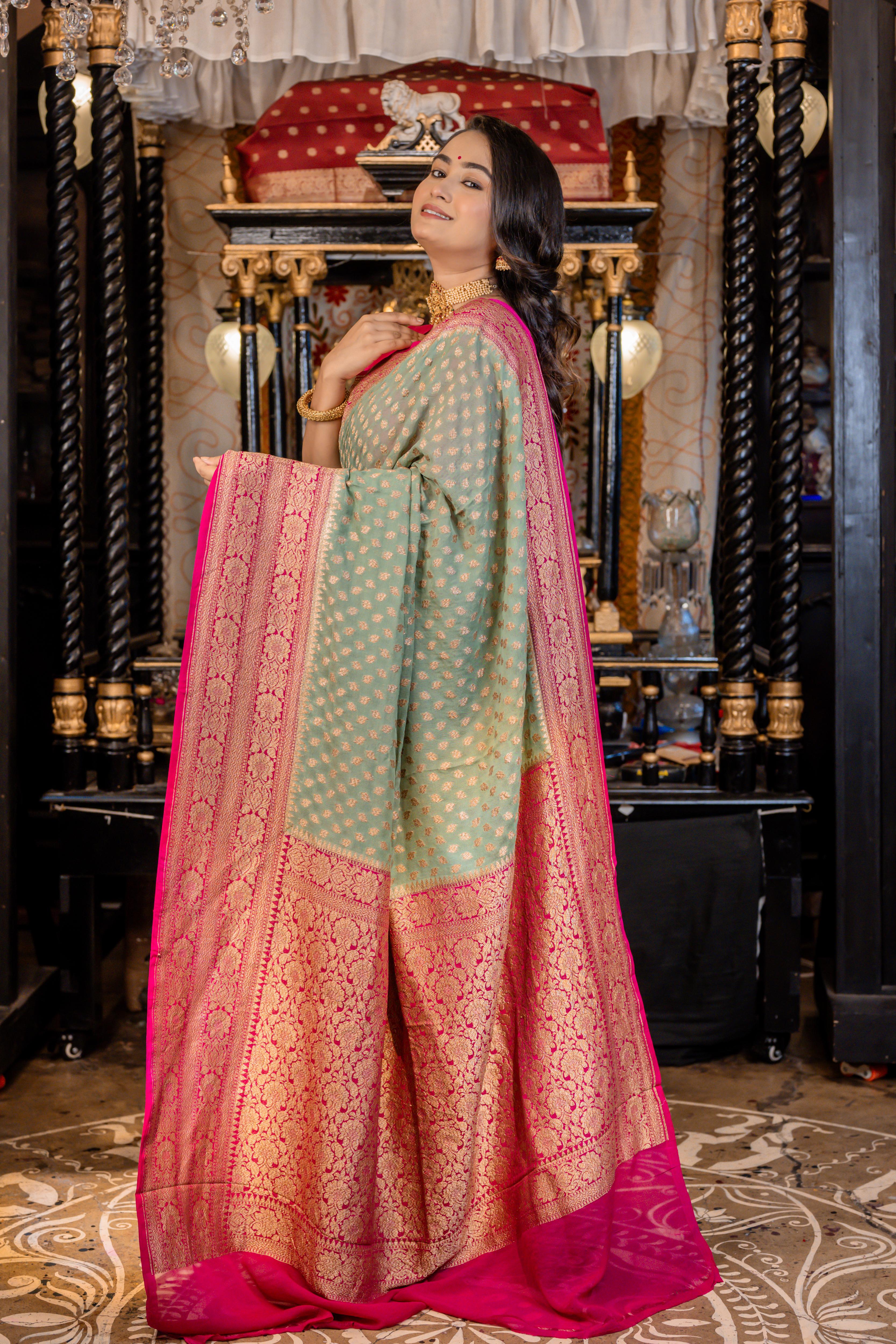 Nirvi || Dusty Teal Khaddi Georgette Banarasi Saree with all over Antique Zari Buti and Magenta Pink border