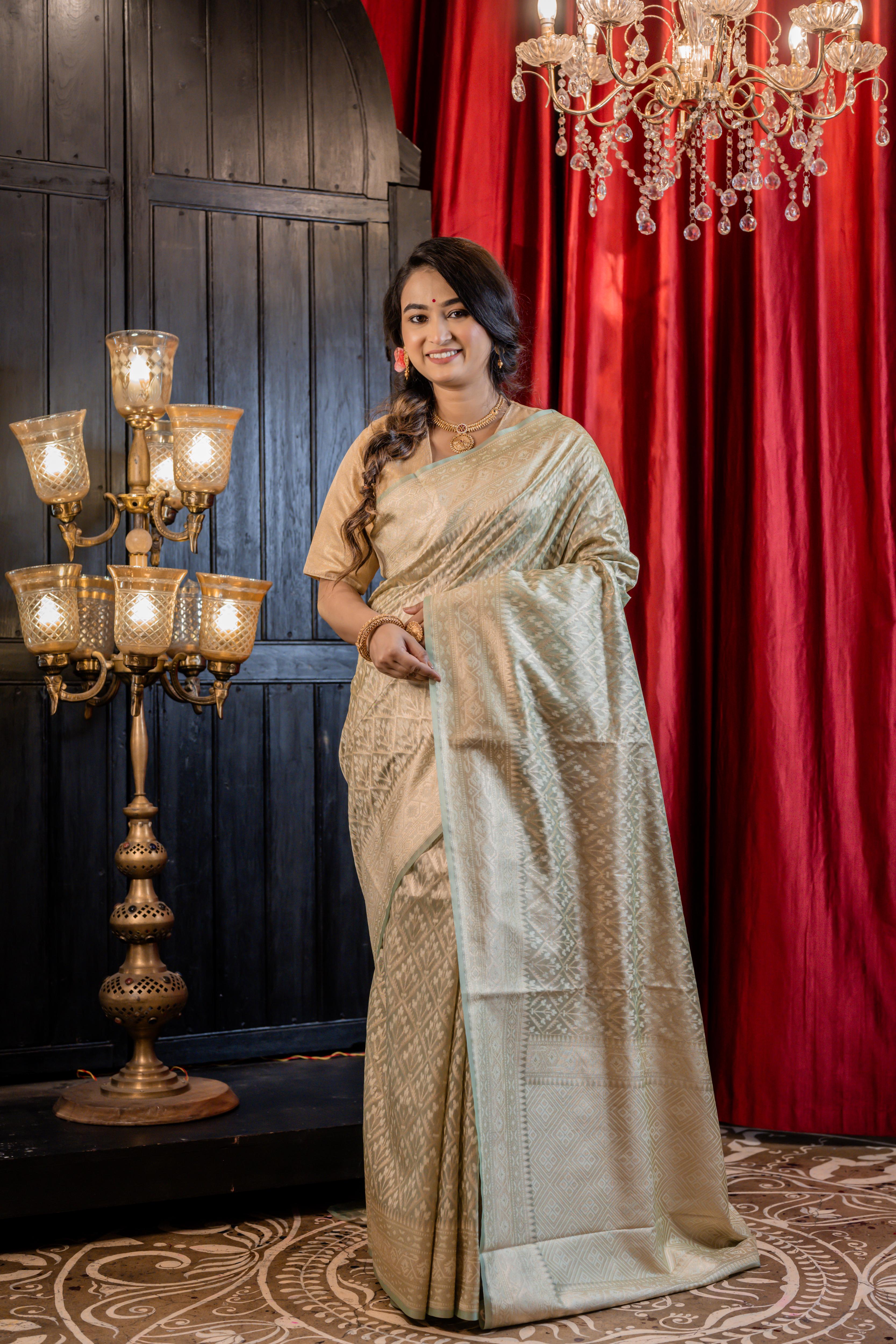 Snigdha || Mint Green Chanderi Katan Tissue Banarasi Saree with all over Leaf motif Buta & Jaal woven in Matte Gold Zari