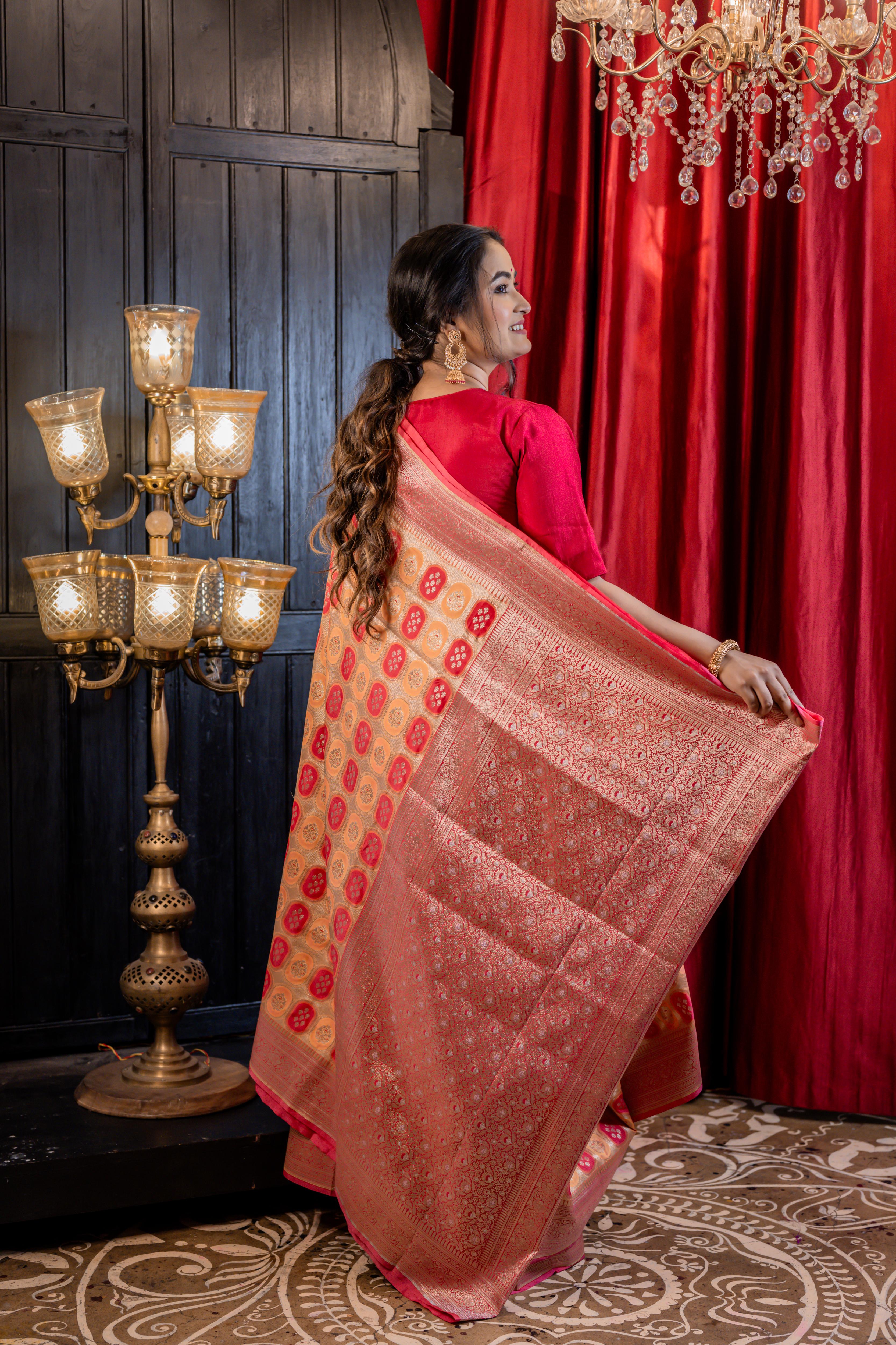 Abha || Woven Matte Gold Zari base Matka Silk Banarasi Saree with all over Peach & Raspberry Red Capsule shape Buta and Meenakari Floral highlights
