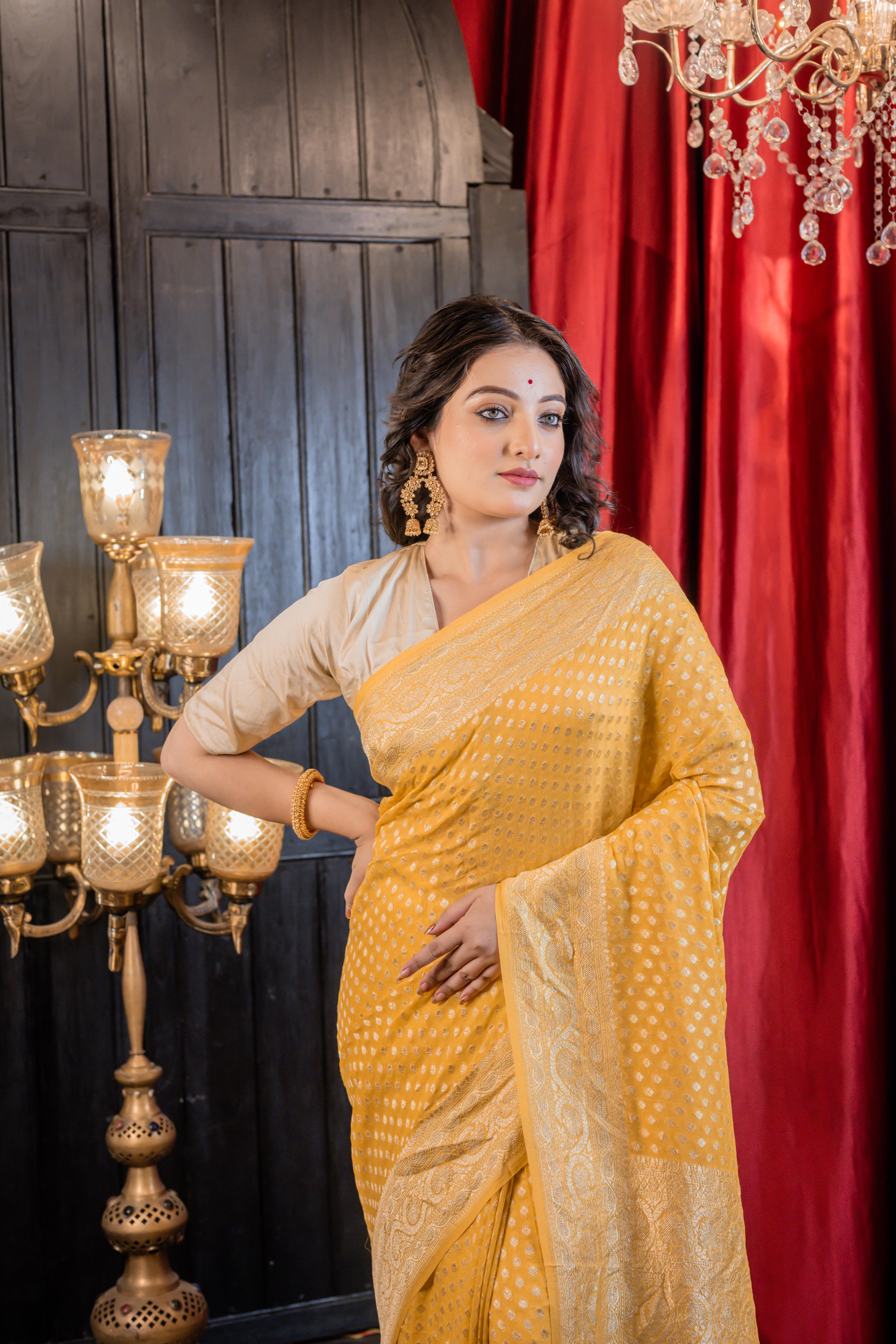 Suravi || Mango Yellow Khaddi Georgette Banarasi Saree with all over Matte Gold Zari Buti